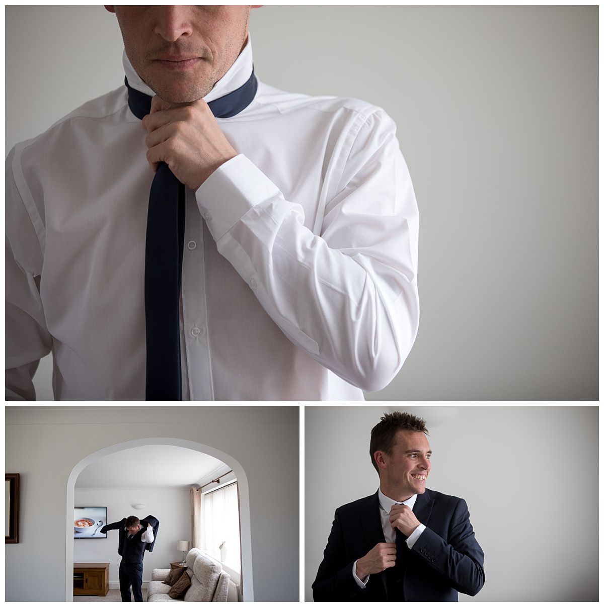 Groom putting on his tie and jacket