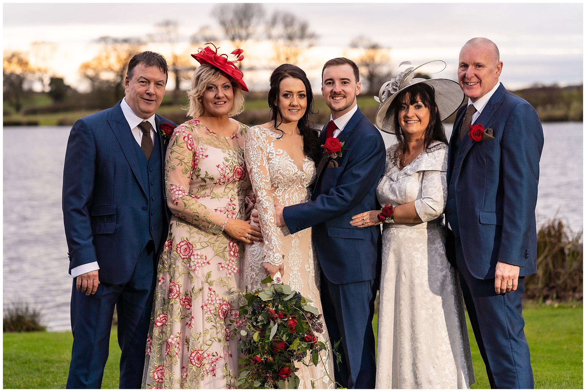 Bride and groom with parents at Sandhole Oak Barn