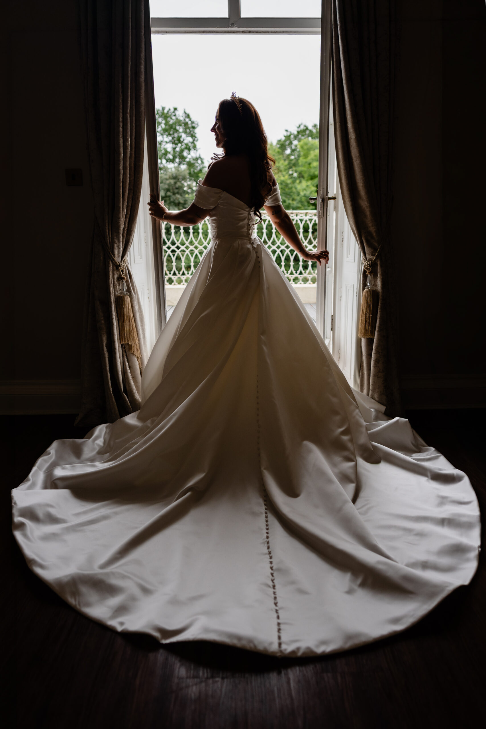Bride's wedding dress train lit by window light, Cheshire wedding photographer