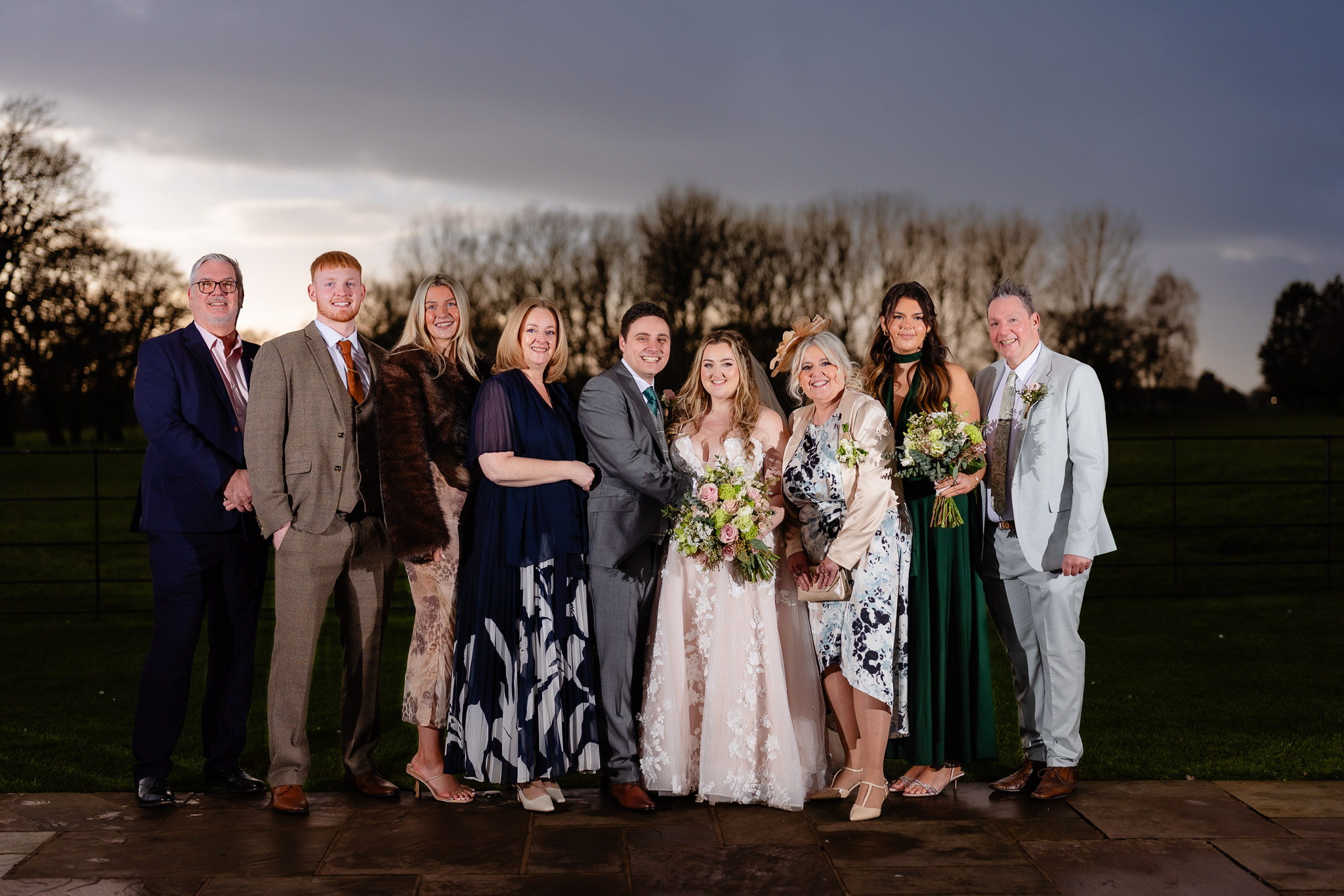 Bride and groom with extended family at their Merrydale Manor wedding, Cheshire wedding photographer