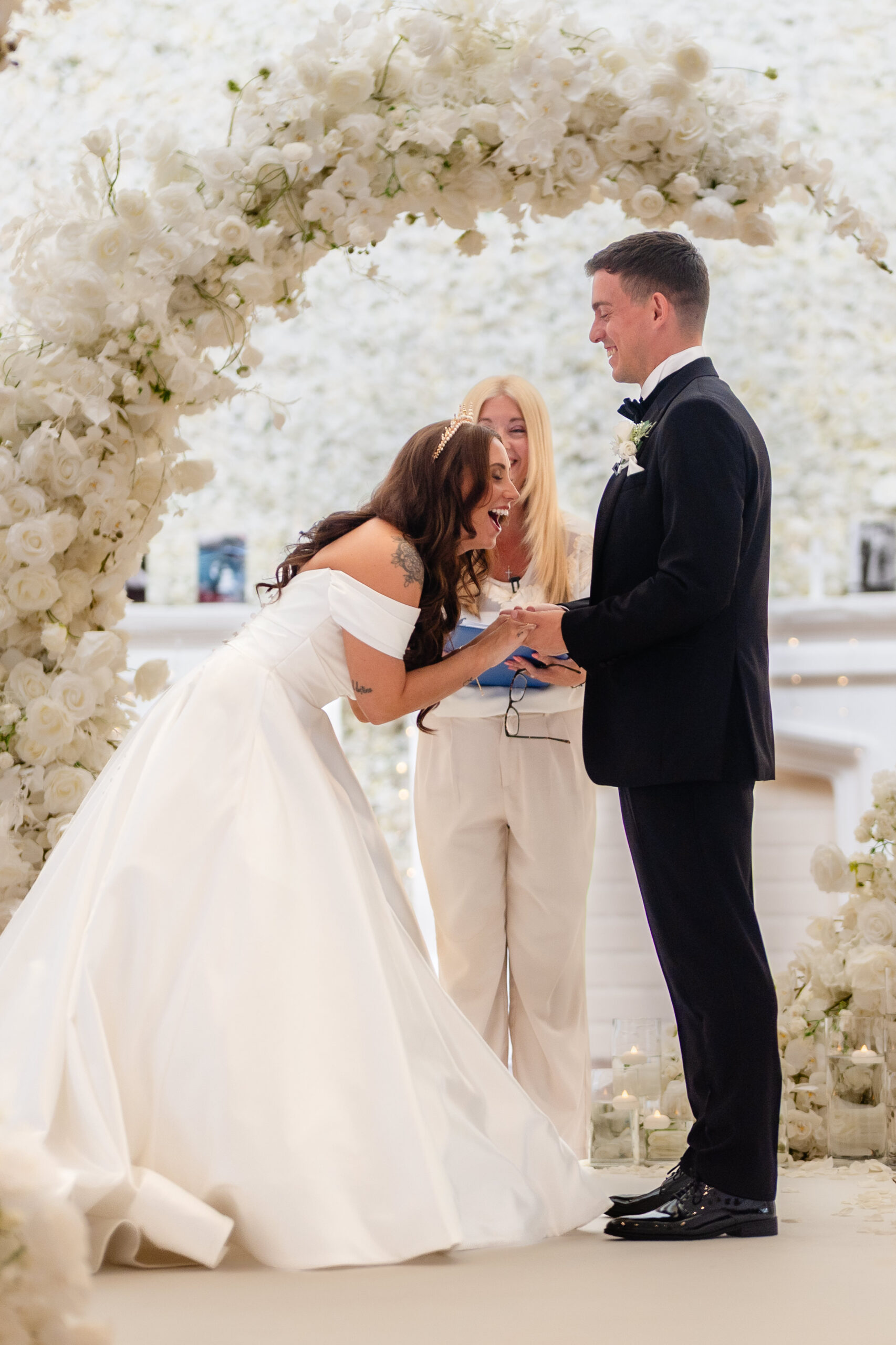 Bride and groom laughing together during their wedding vows
