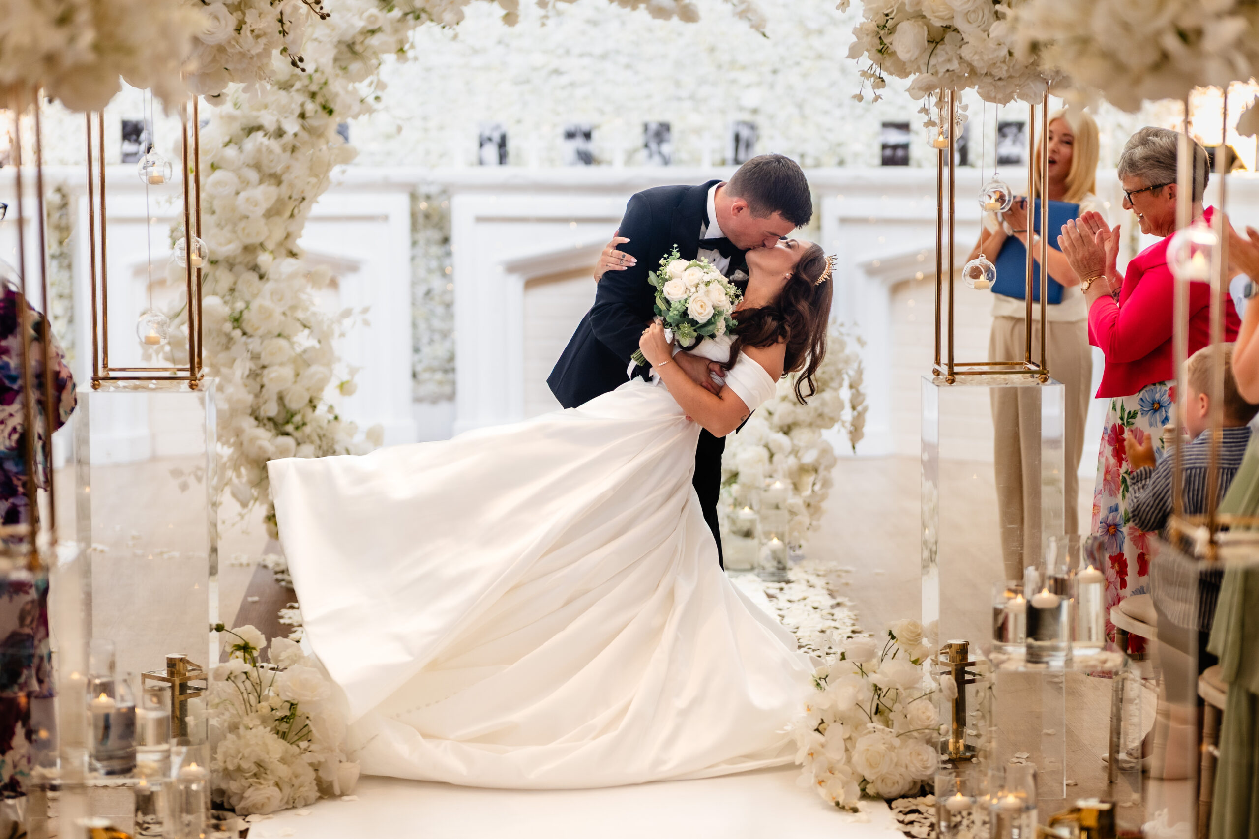Newlyweds walking through confetti at Rainhill Hall, black and white
