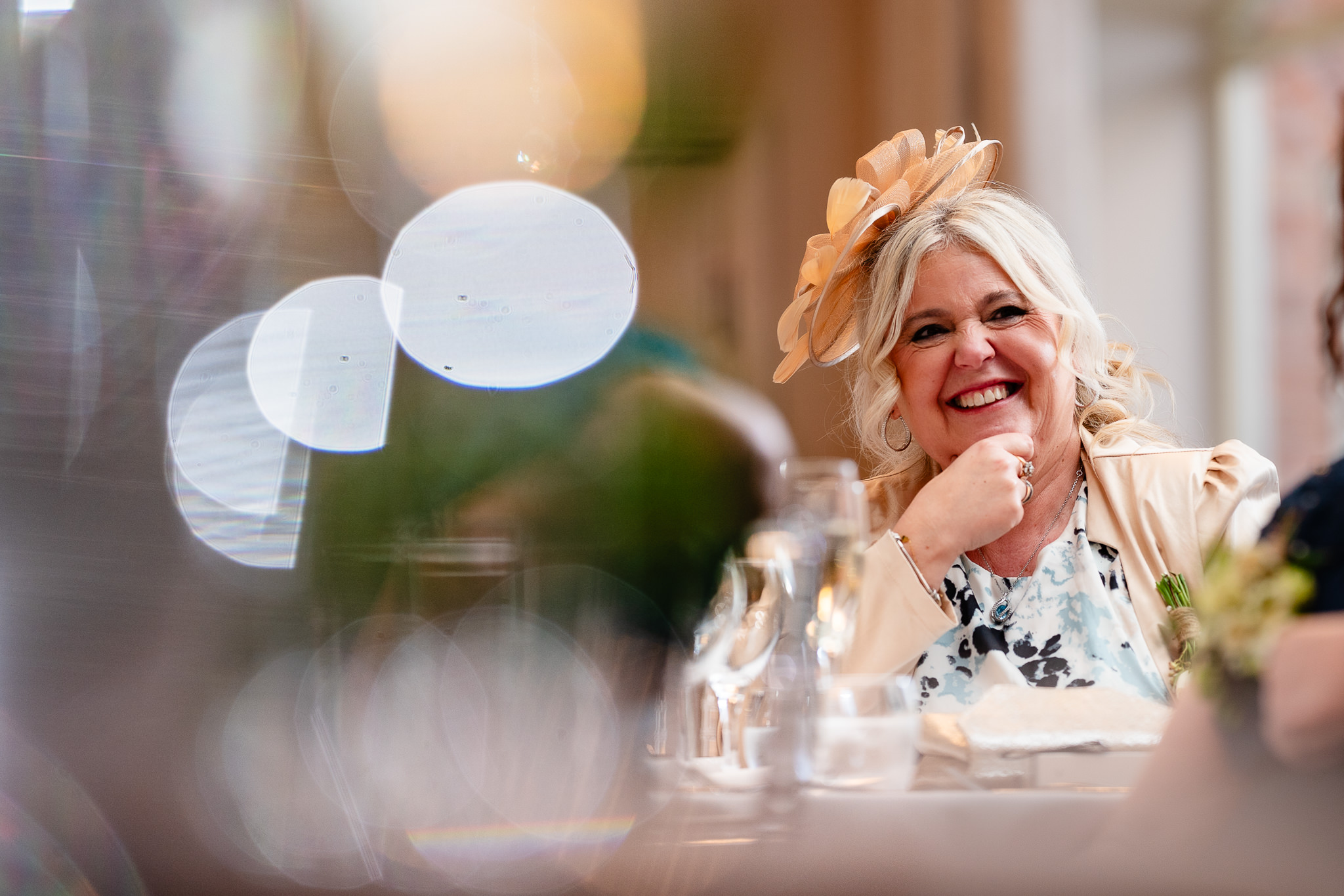 Wedding guest laughing during speeches at Merrydale Manor, Cheshire wedding photographer