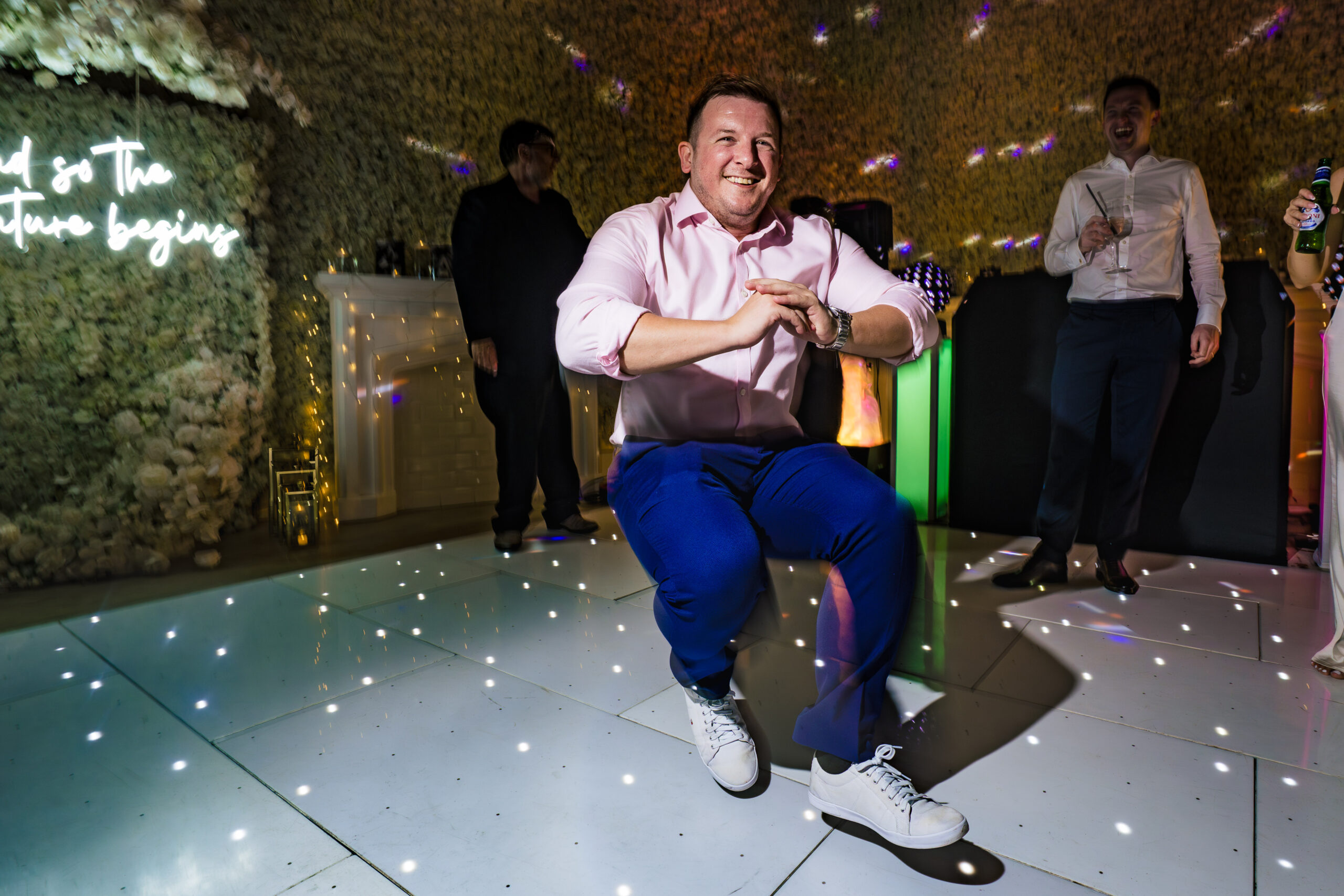 Wedding guests having fun on the dancefloor in the evening