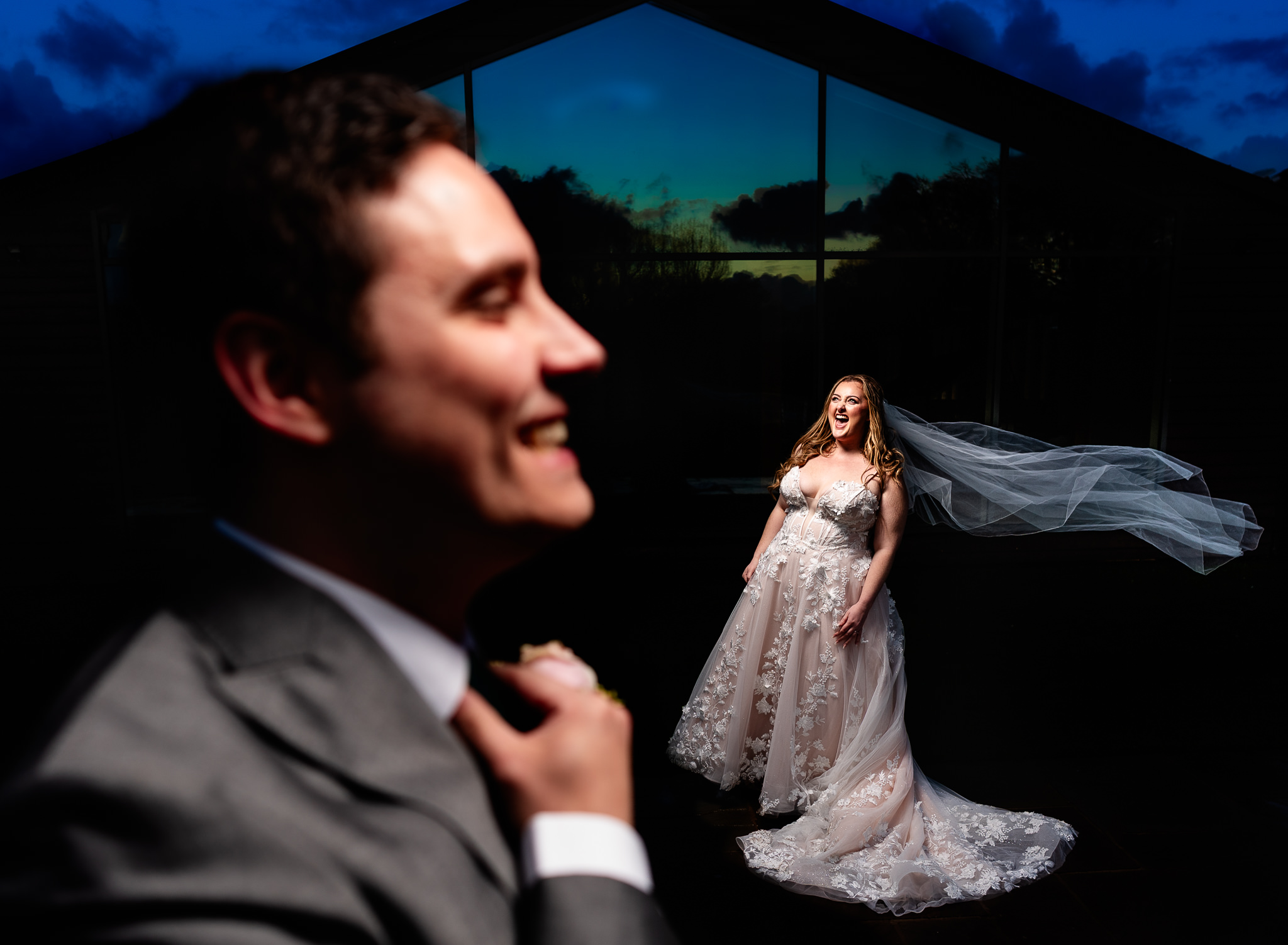Evening portrait of bride and groom with veil blowing in the wind at Merrydale Manor, Cheshire wedding photographer