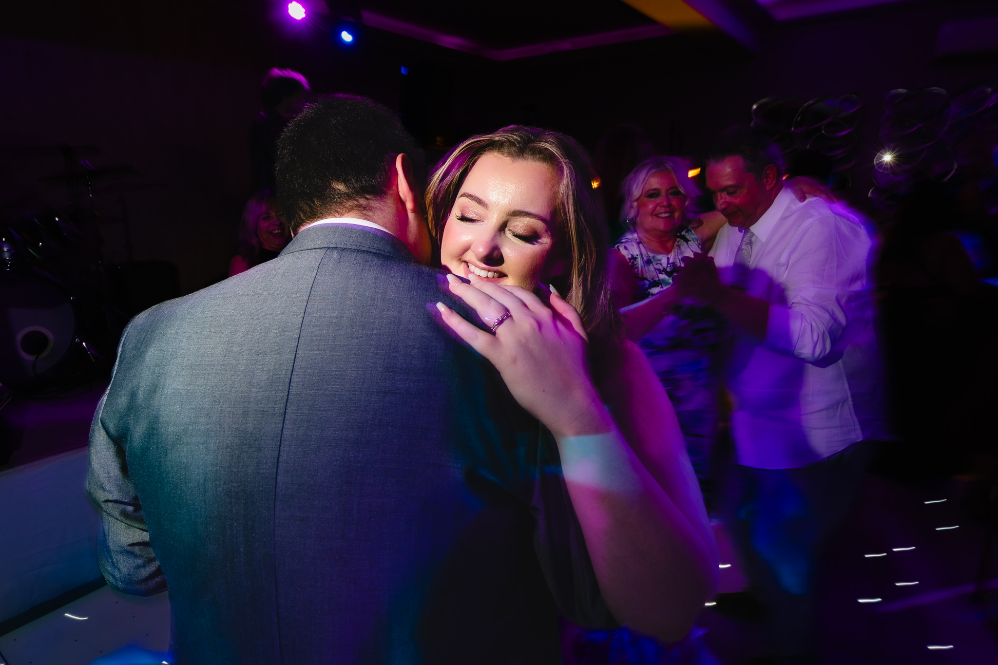 Close up of bride and groom slow dancing at their Merrydale Manor wedding, Cheshire wedding photographer