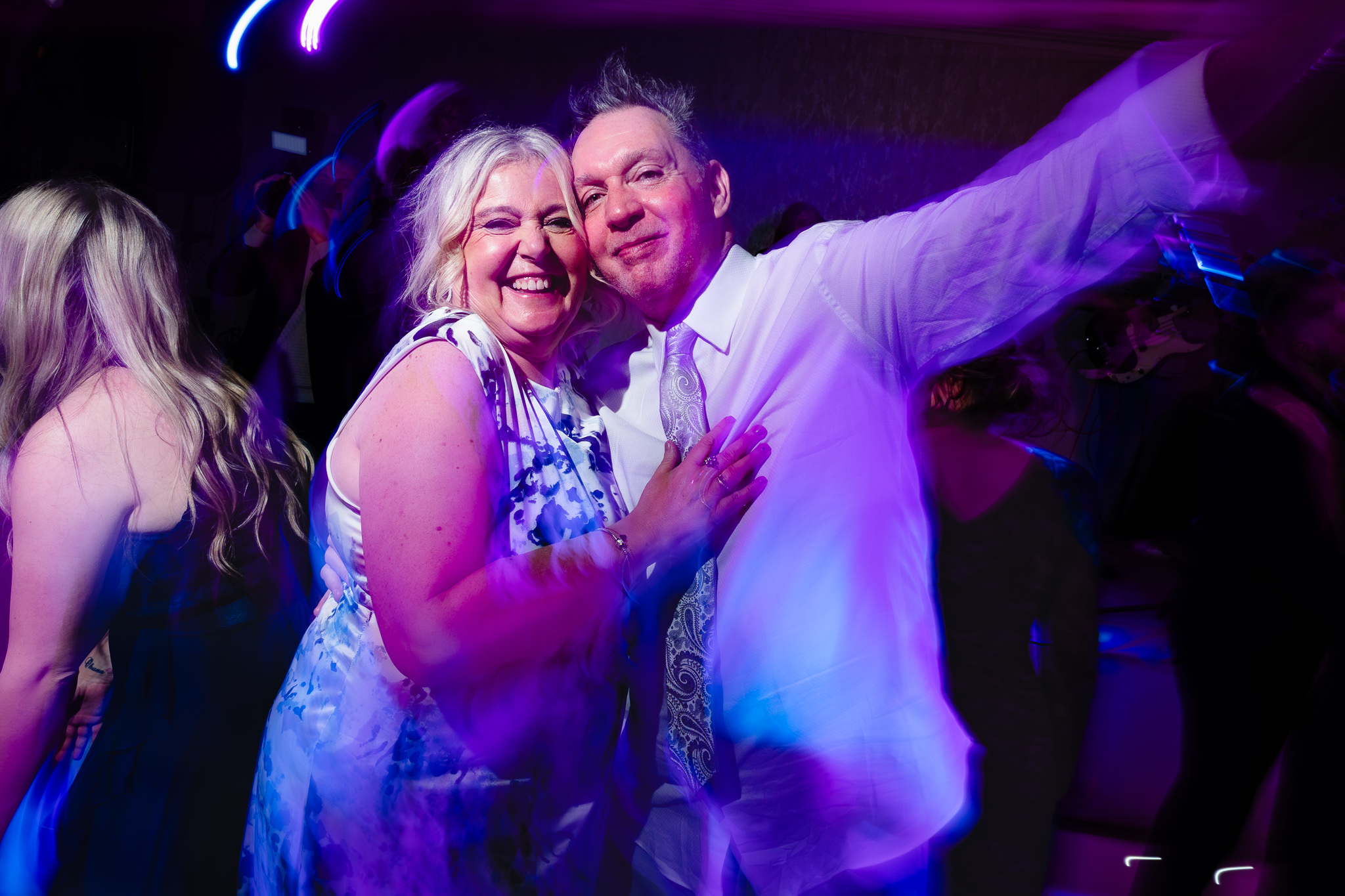 Guests dancing together at Merrydale Manor evening wedding reception, Cheshire wedding photographer
