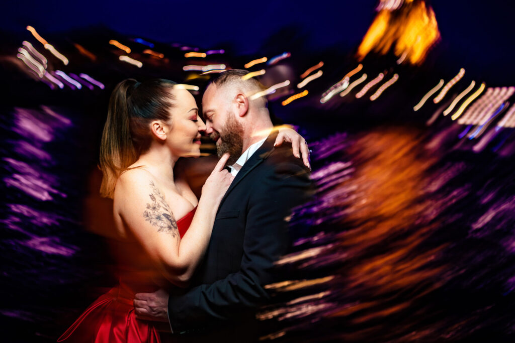 Bride and groom dancing at their wedding reception, photographed with coloured light trails