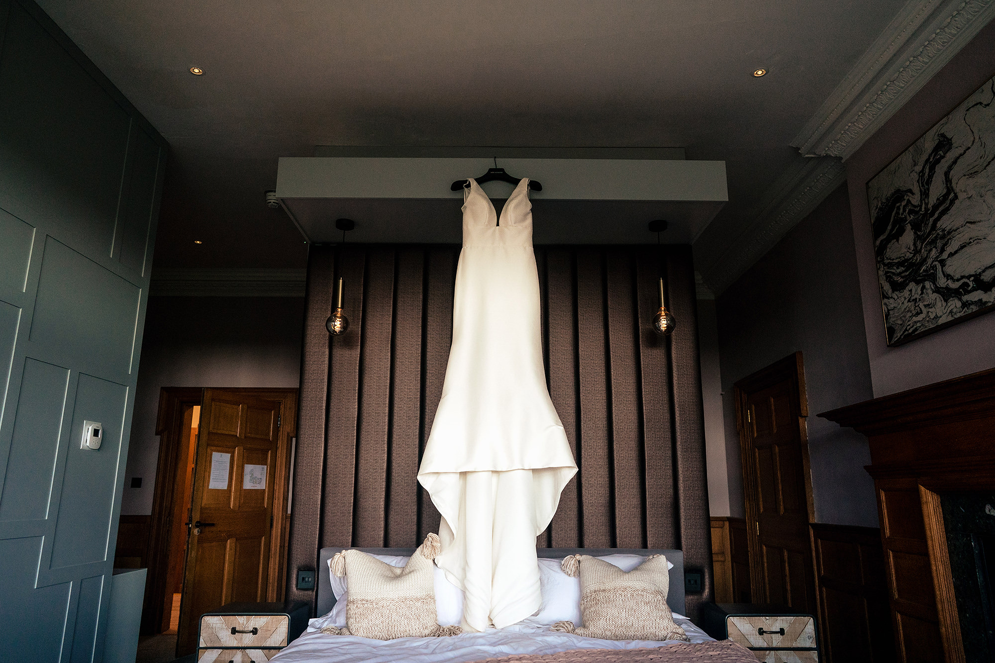 Chloe’s wedding dress from 7th Heaven Bridal hanging in the window at Salt House