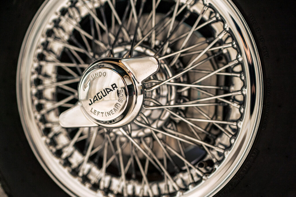 Close up of the chrome wire wheel and Jaguar spinner on the restored E-type wedding car, Cheshire wedding photographer