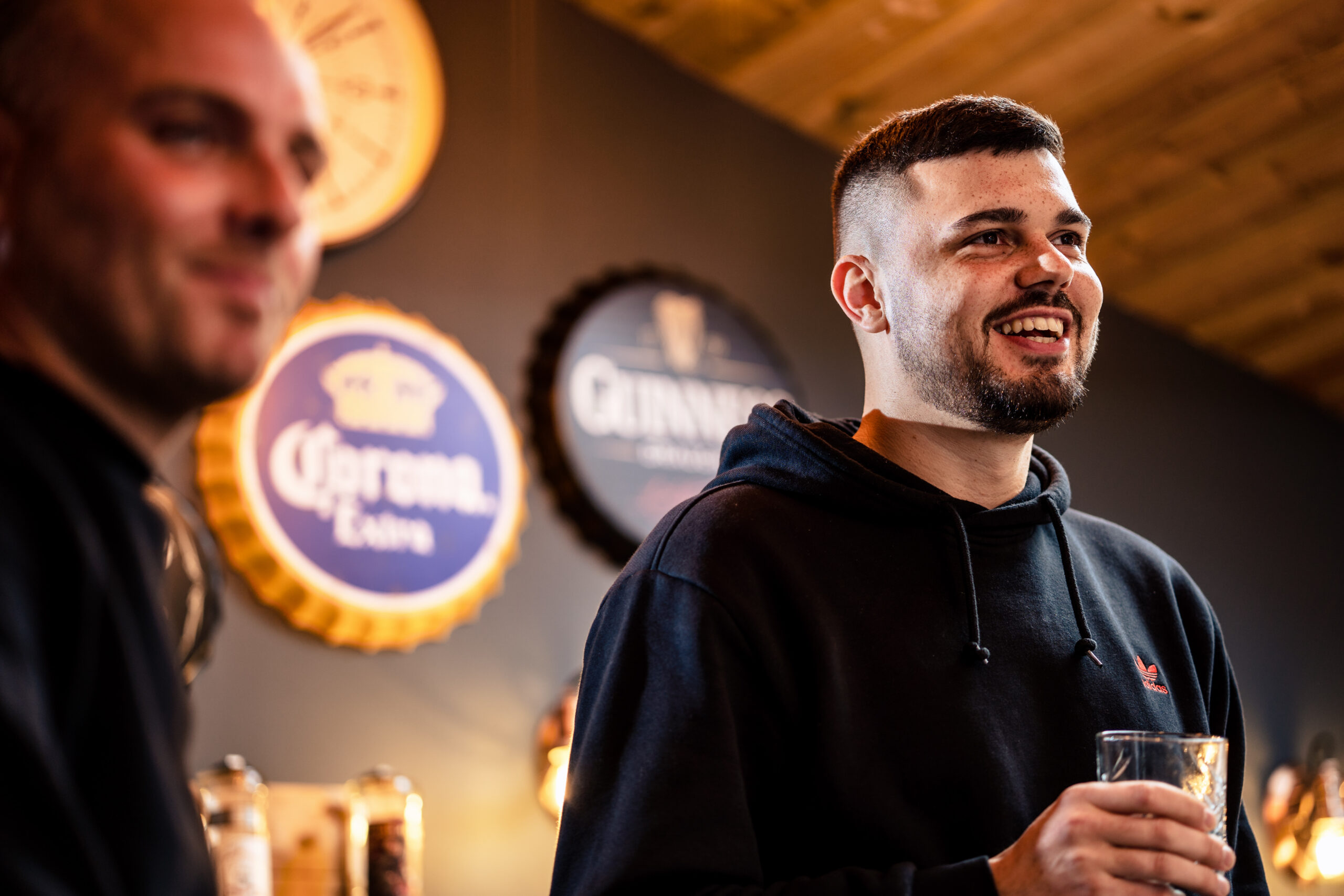 Dean laughing in the Man Cave groom prep room at Merrydale Manor, Cheshire wedding photographer