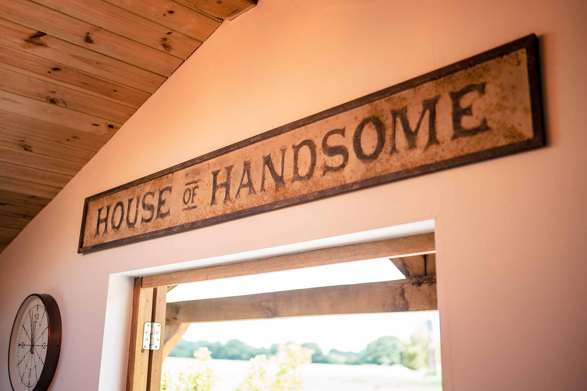 The House of Handsome sign above Ryan's getting ready room, Merrydale Manor wedding photographer