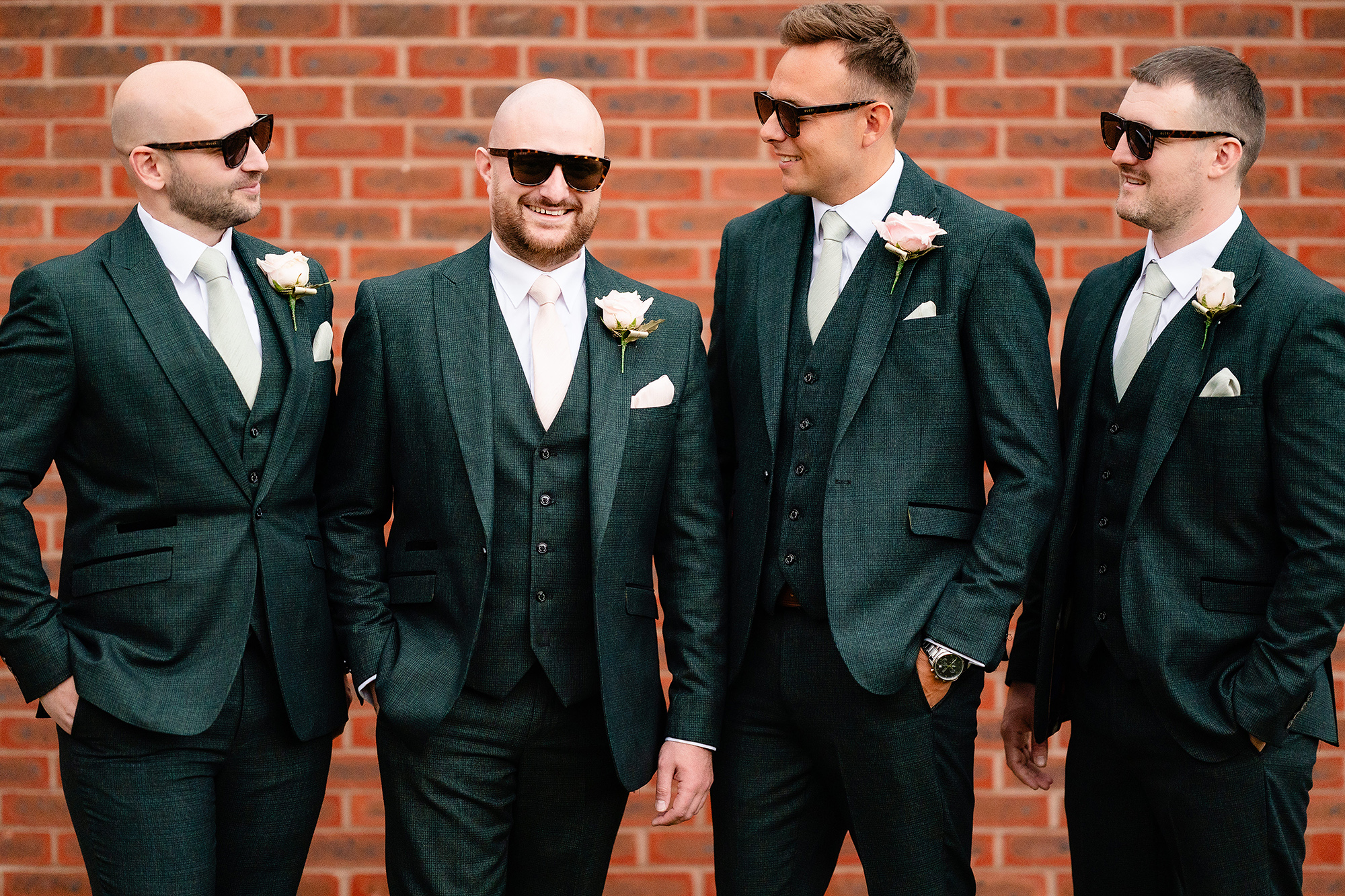 The groomsmen lined up in sunglasses outside before heading to church, Cheshire wedding photographer