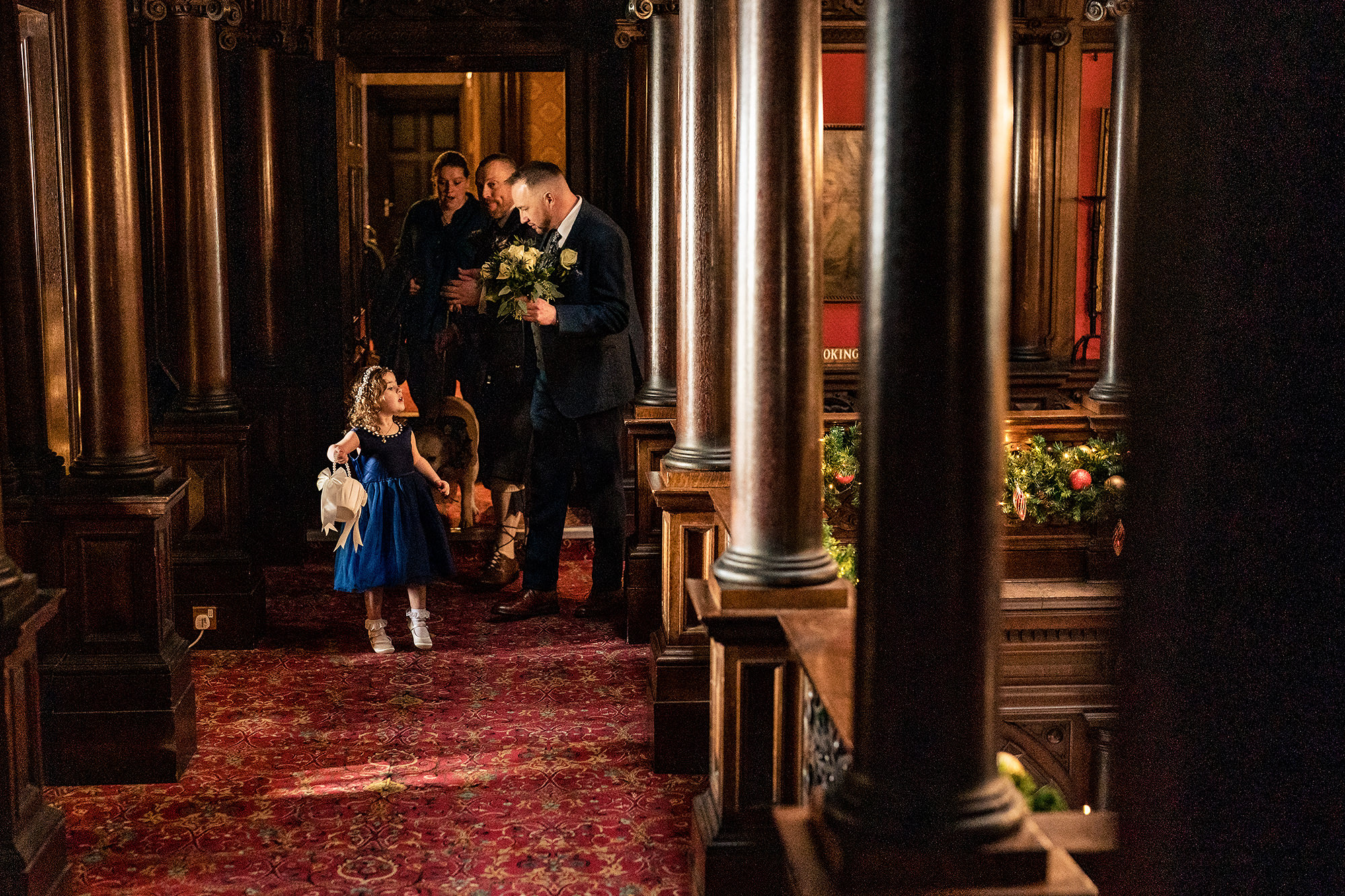 The flower girl walking down the aisle at the start of the ceremony, Crewe Hall wedding photographer