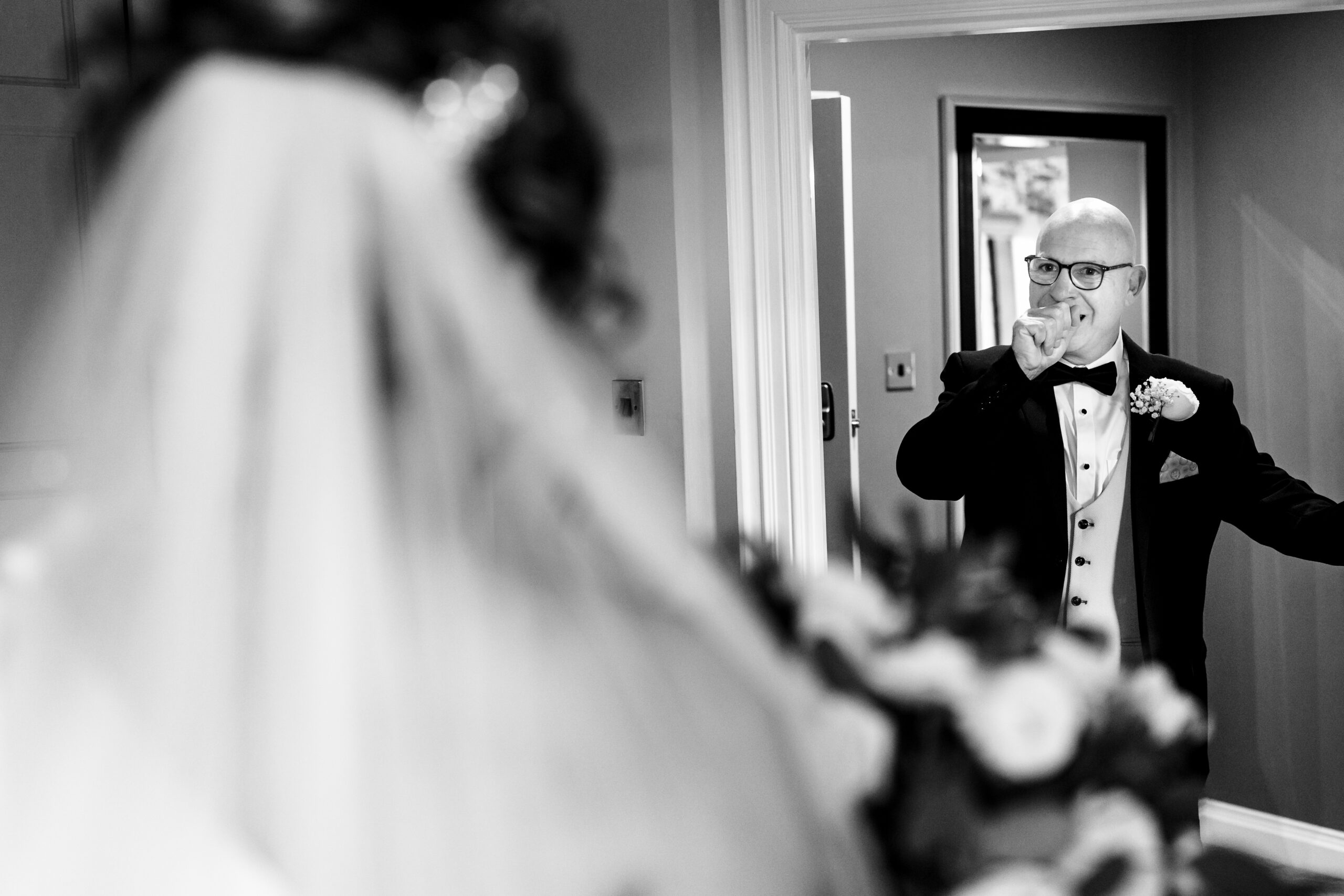 Georgia’s veil caught mid movement as the final touches went on before the ceremony