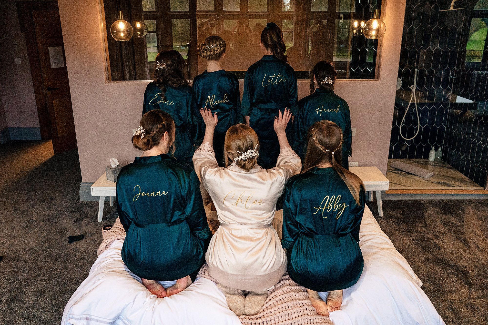 Chloe and her bridesmaids in matching robes before getting dressed