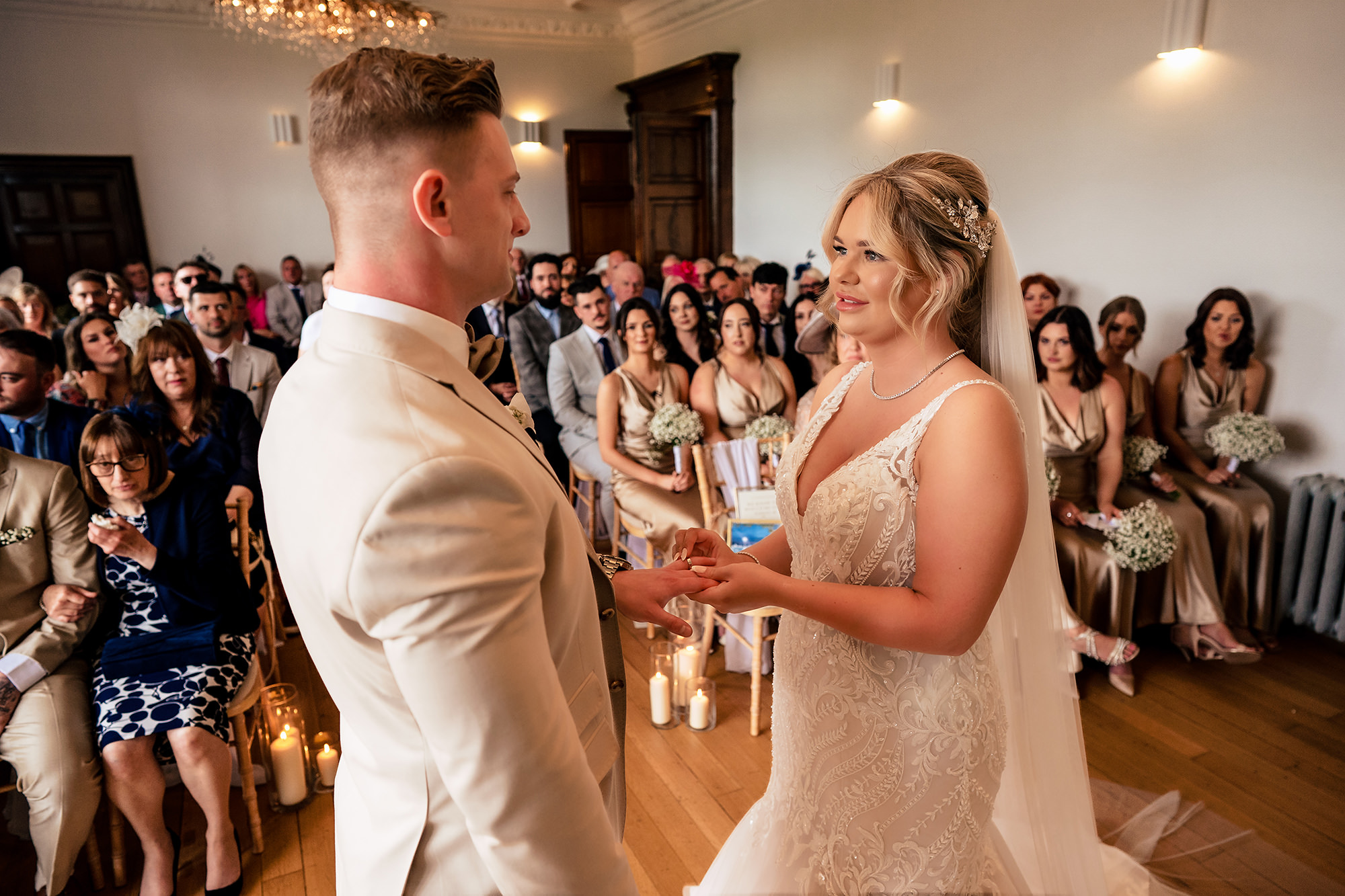 Jess and Cy exchanging rings in front of their guests at Salt House, Staffordshire wedding photography