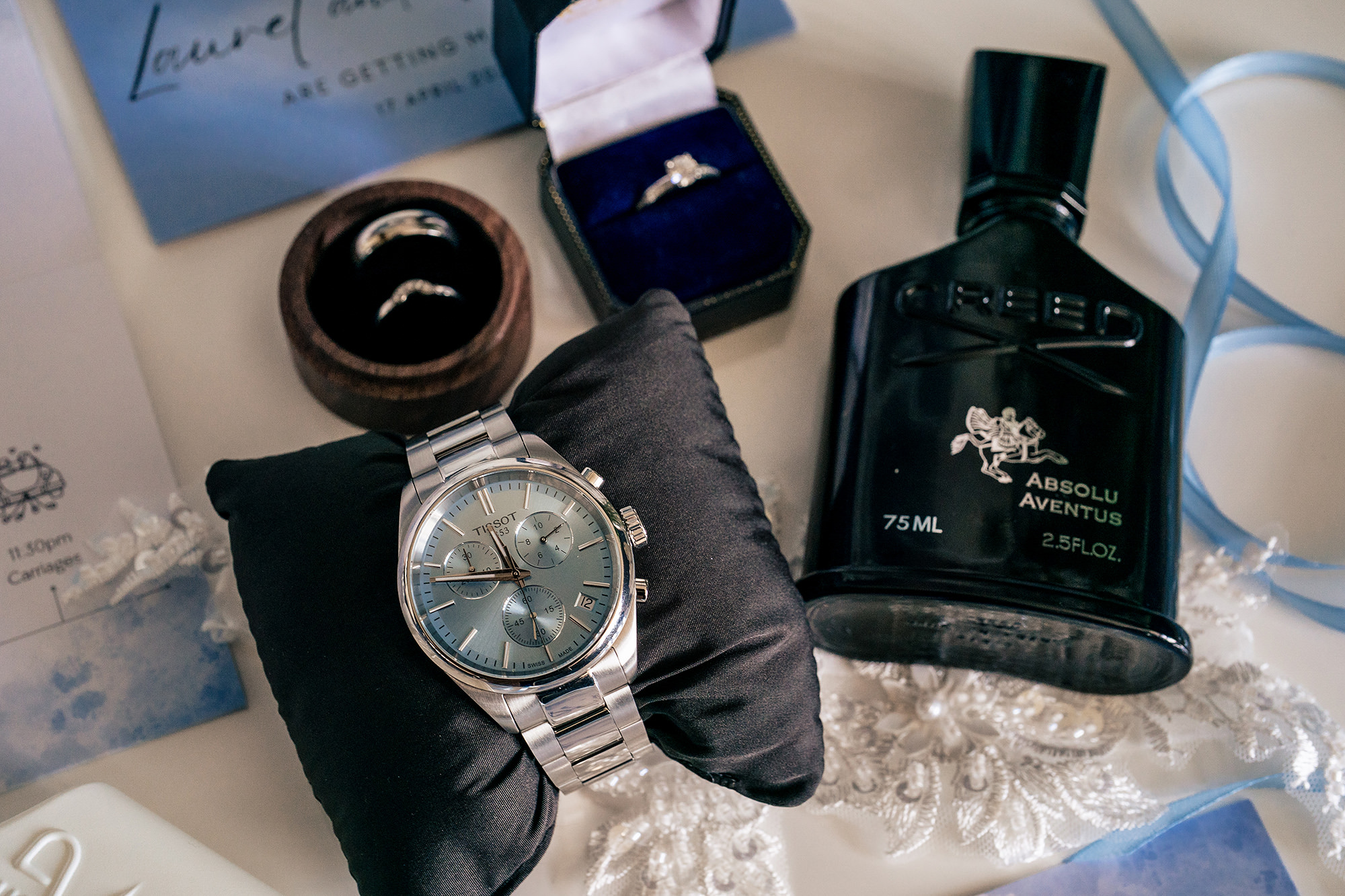 Groom’s wedding ring, watch and aftershave laid out on the morning of the wedding, Salt House wedding photographer