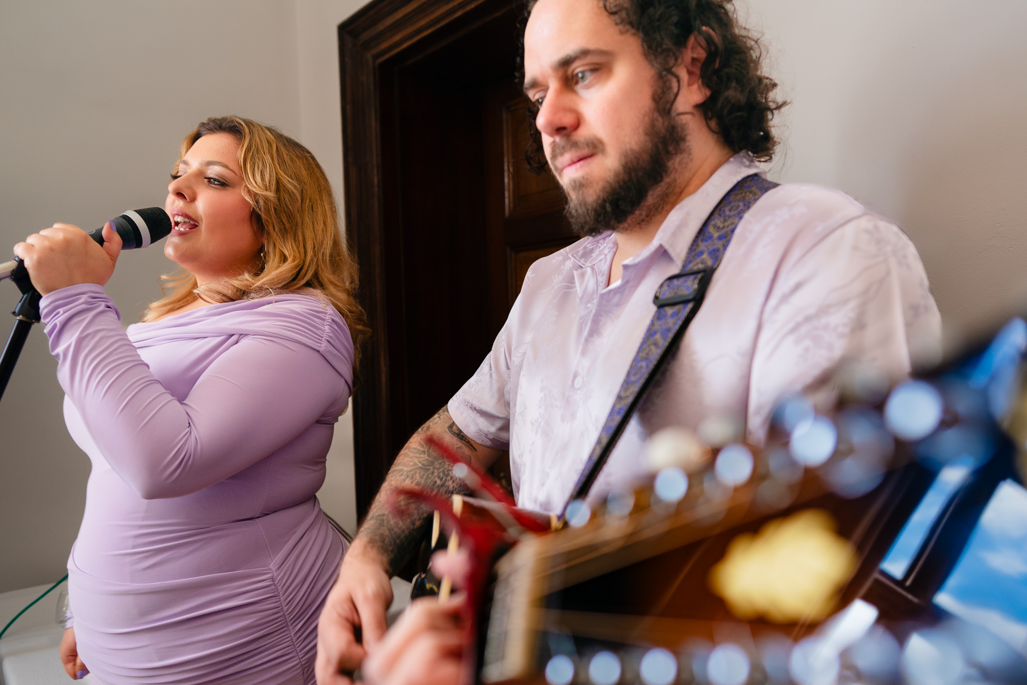 The acoustic duo performing to guests during the drinks reception at Salt House