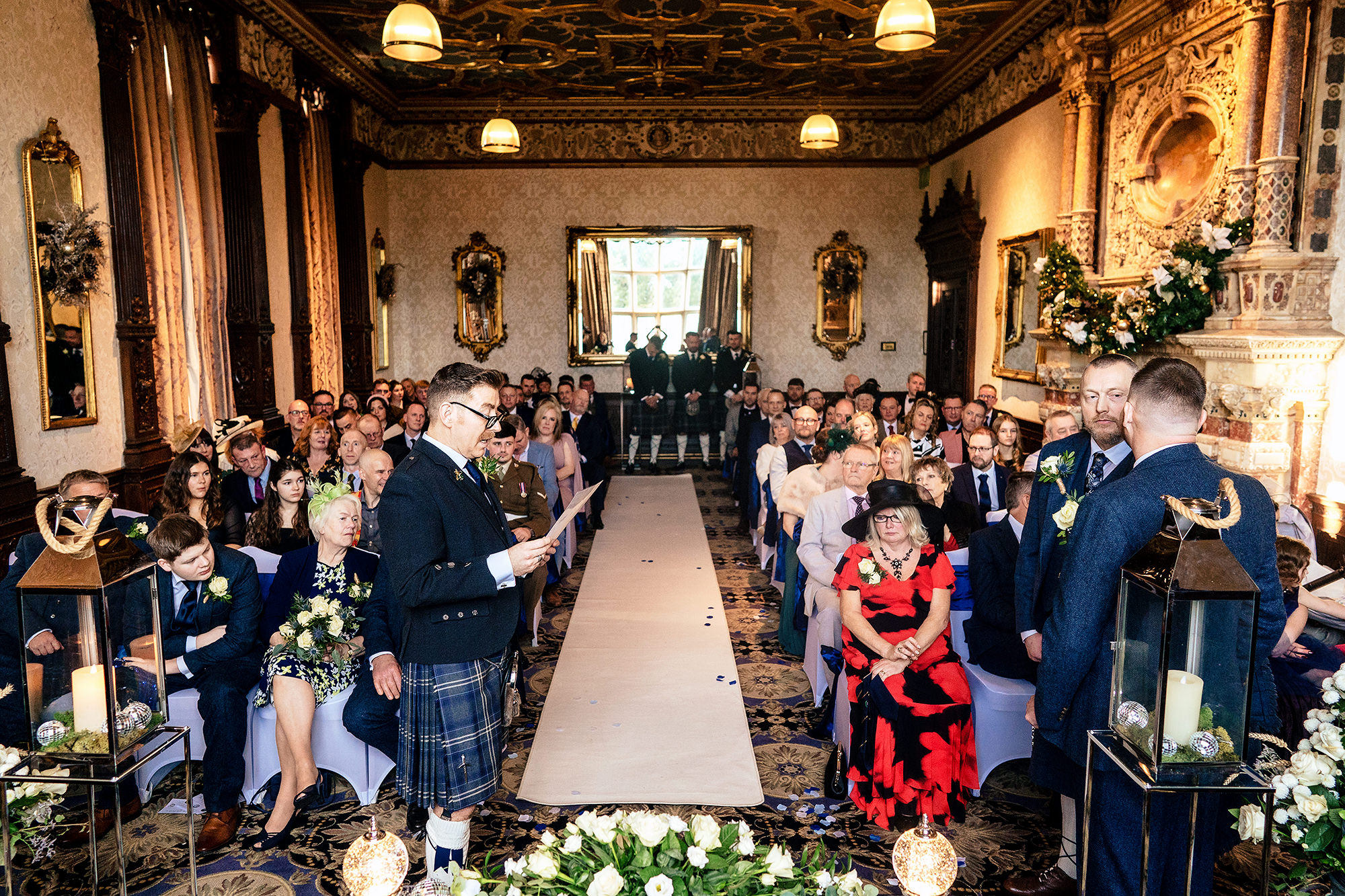 Guests watching on during the ceremony, including one in full military dress uniform