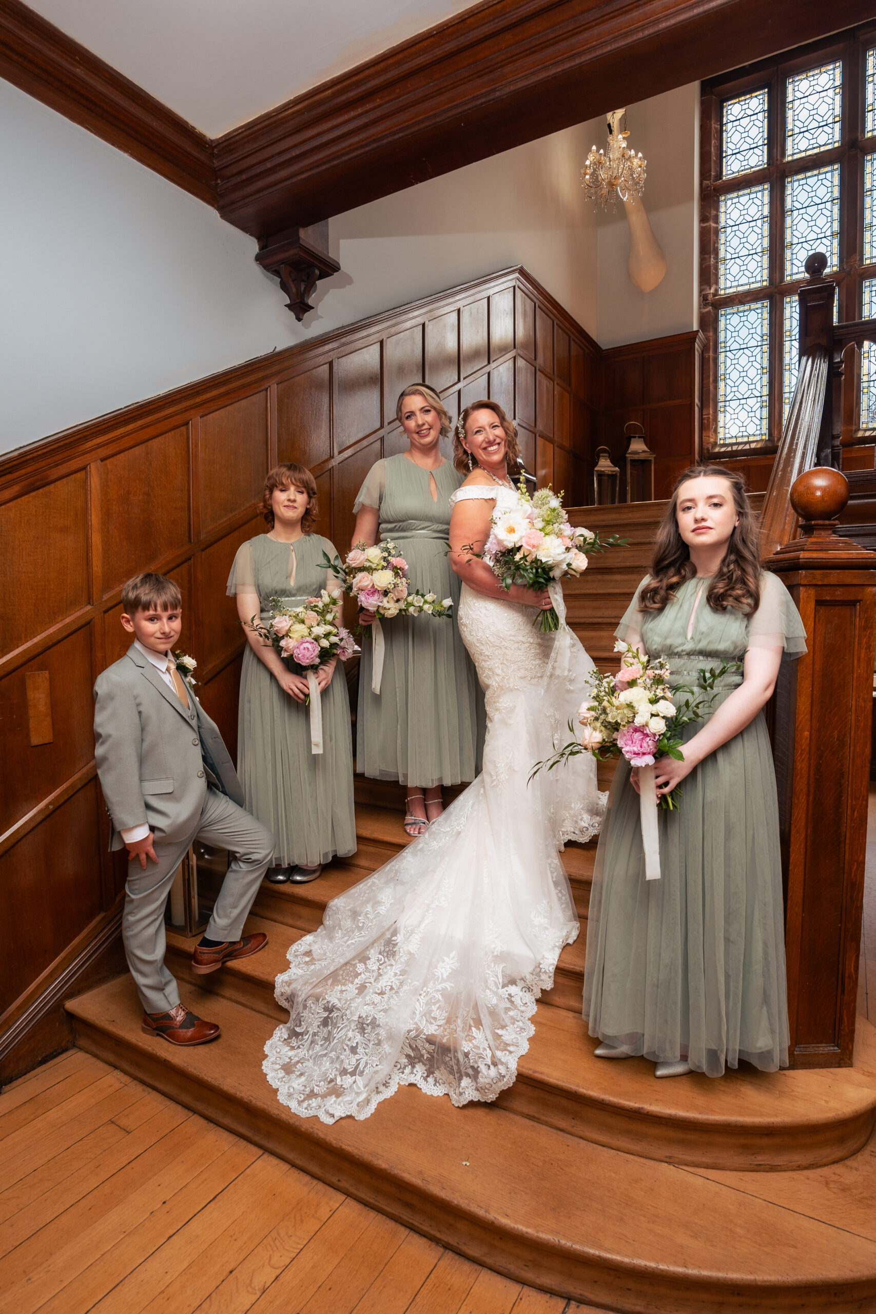 Bride and her bridal party descending the wooden staircase at Salt House on the way to the ceremony