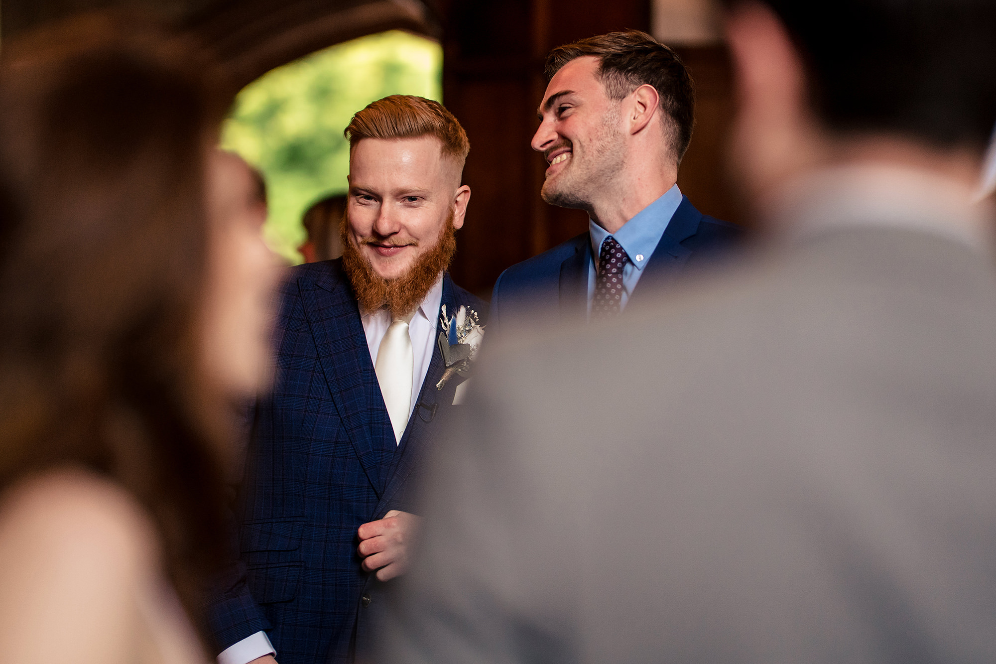 Groomsmen sharing a laugh together before the ceremony, Salt House wedding photographer