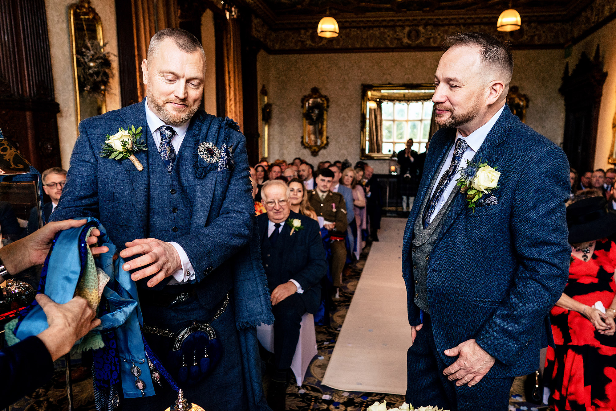A final adjustment to a buttonhole part way through the ceremony