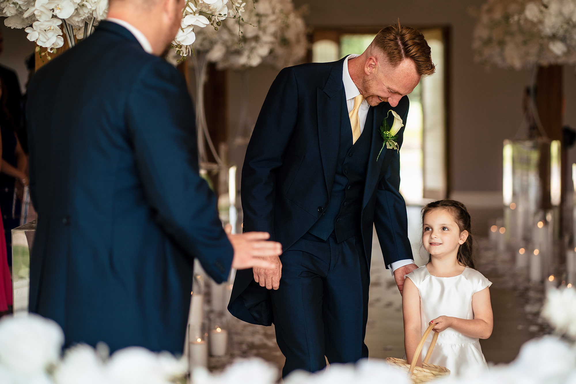 A flower girl walking into the ceremony with one of the ushers, Merrydale Manor wedding photographer
