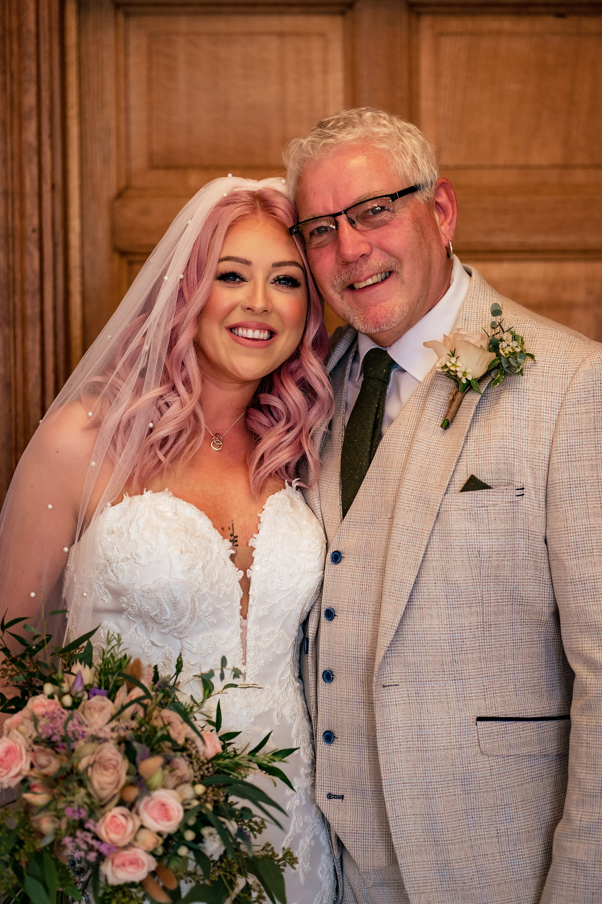 Bride and her dad smiling together before her Standon Hall wedding ceremony