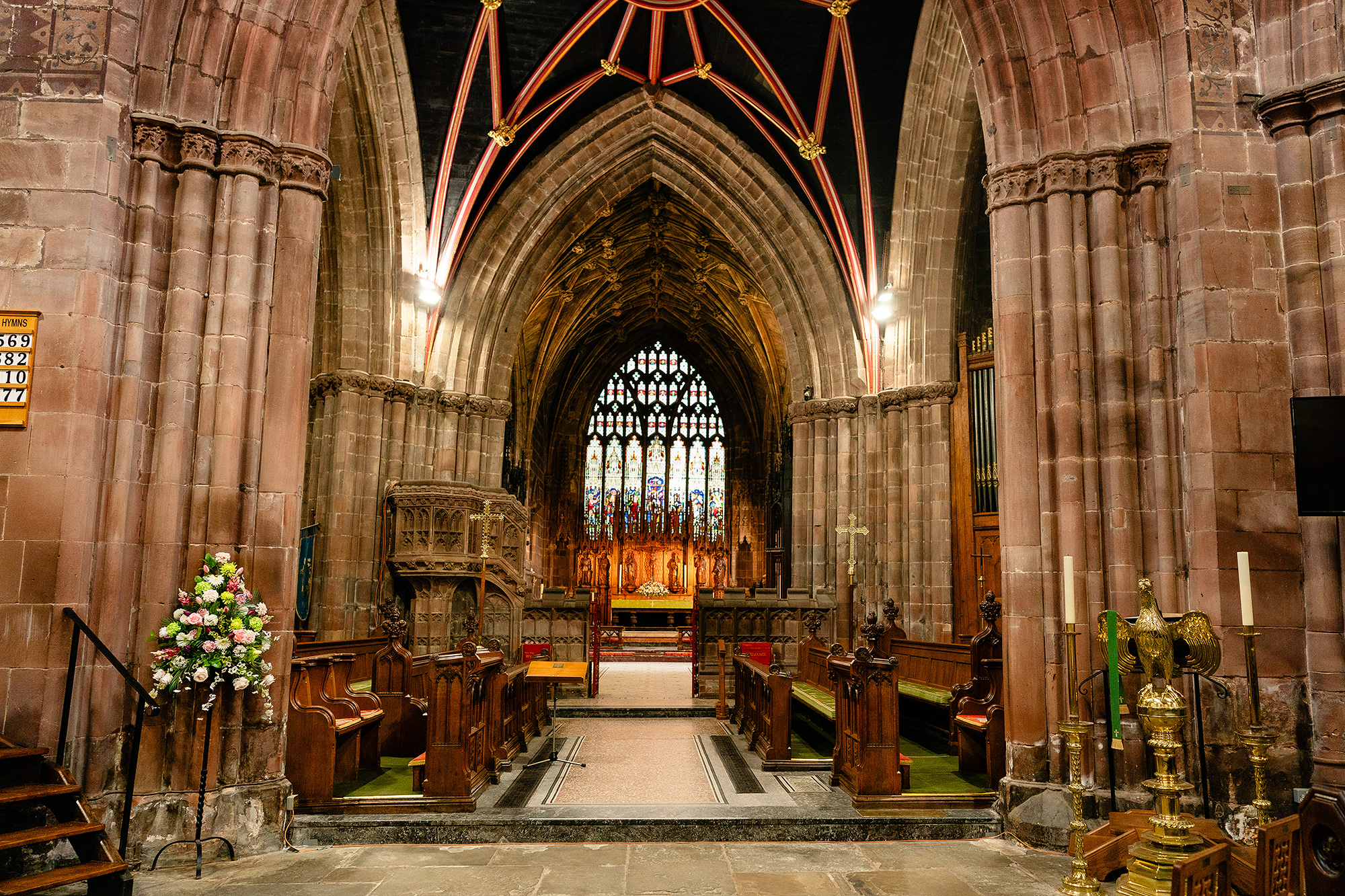 A wide symmetrical view down St Mary’s Church nave towards the altar