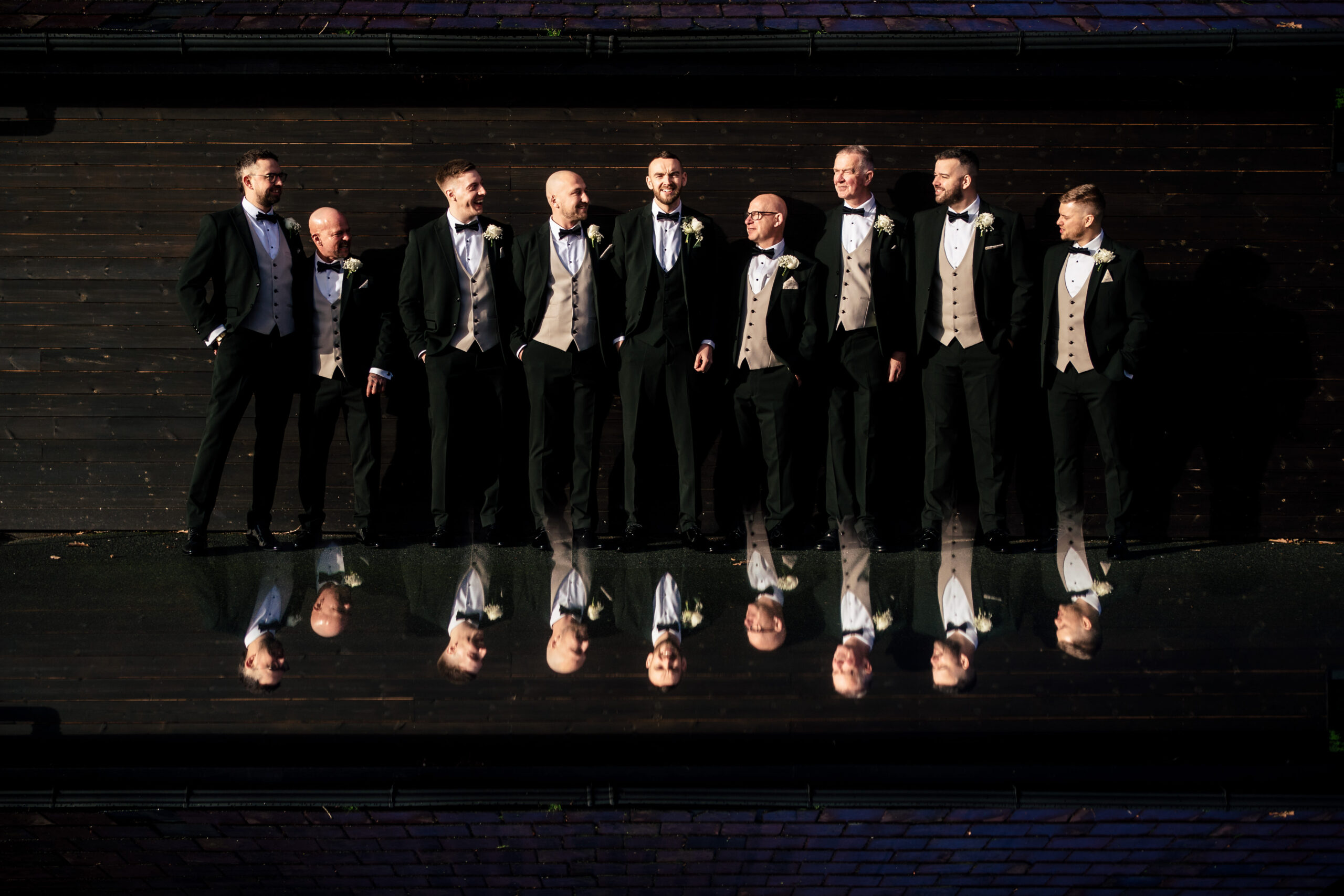 Joe and his groomsmen reflected in the mirror before heading down to the ceremony