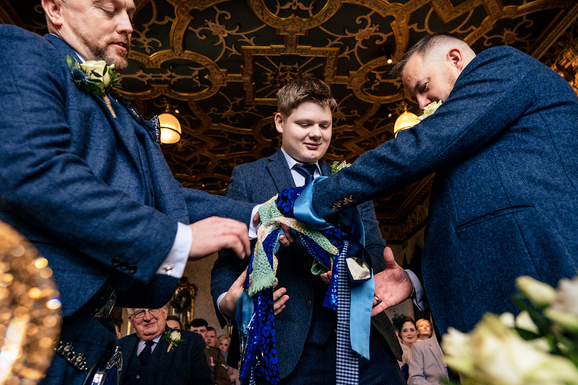 The hand fasting ribbons being tied during the ceremony at Crewe Hall