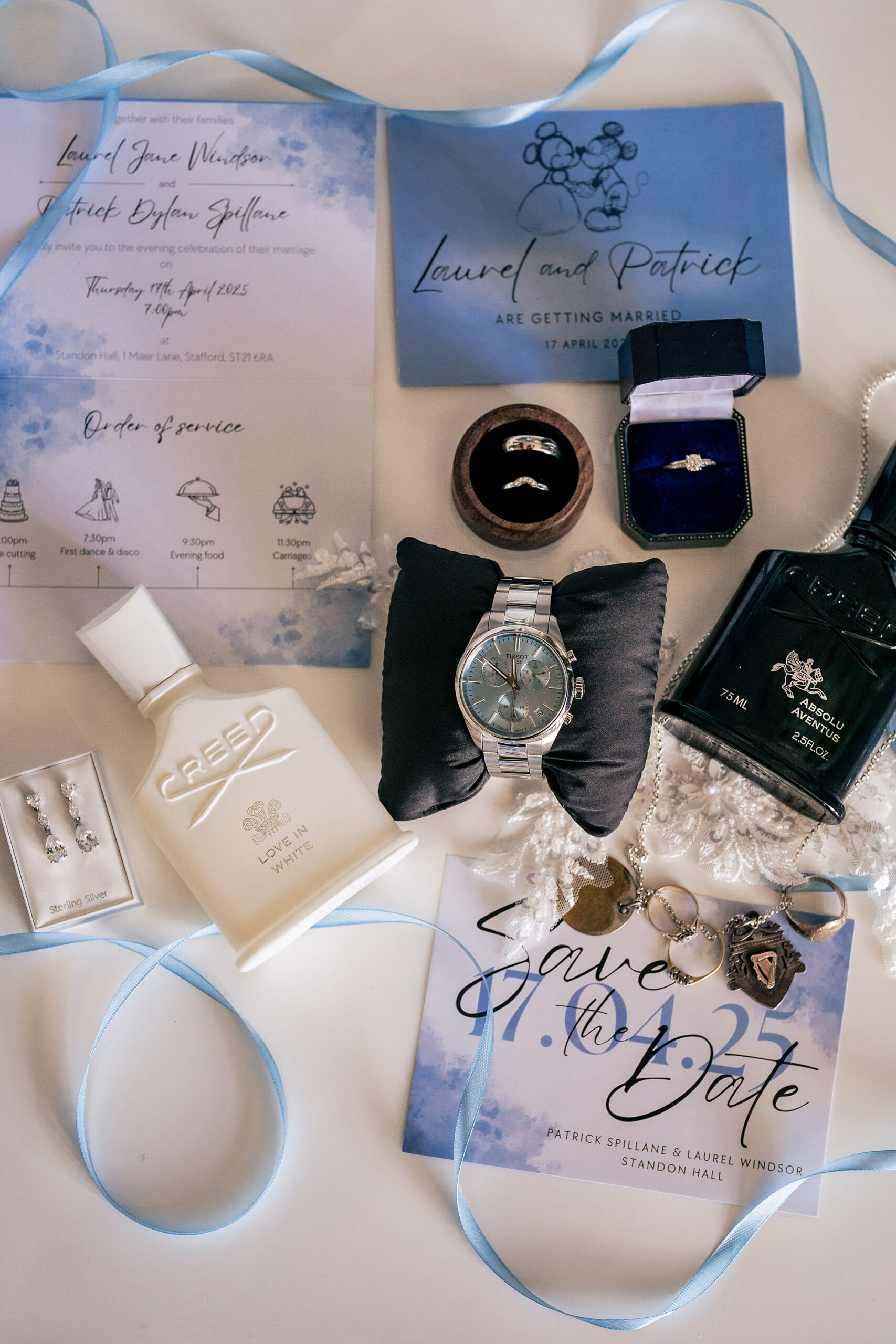 Wedding invitation, rings and watch styled together on the morning of the wedding, Salt House wedding photographer