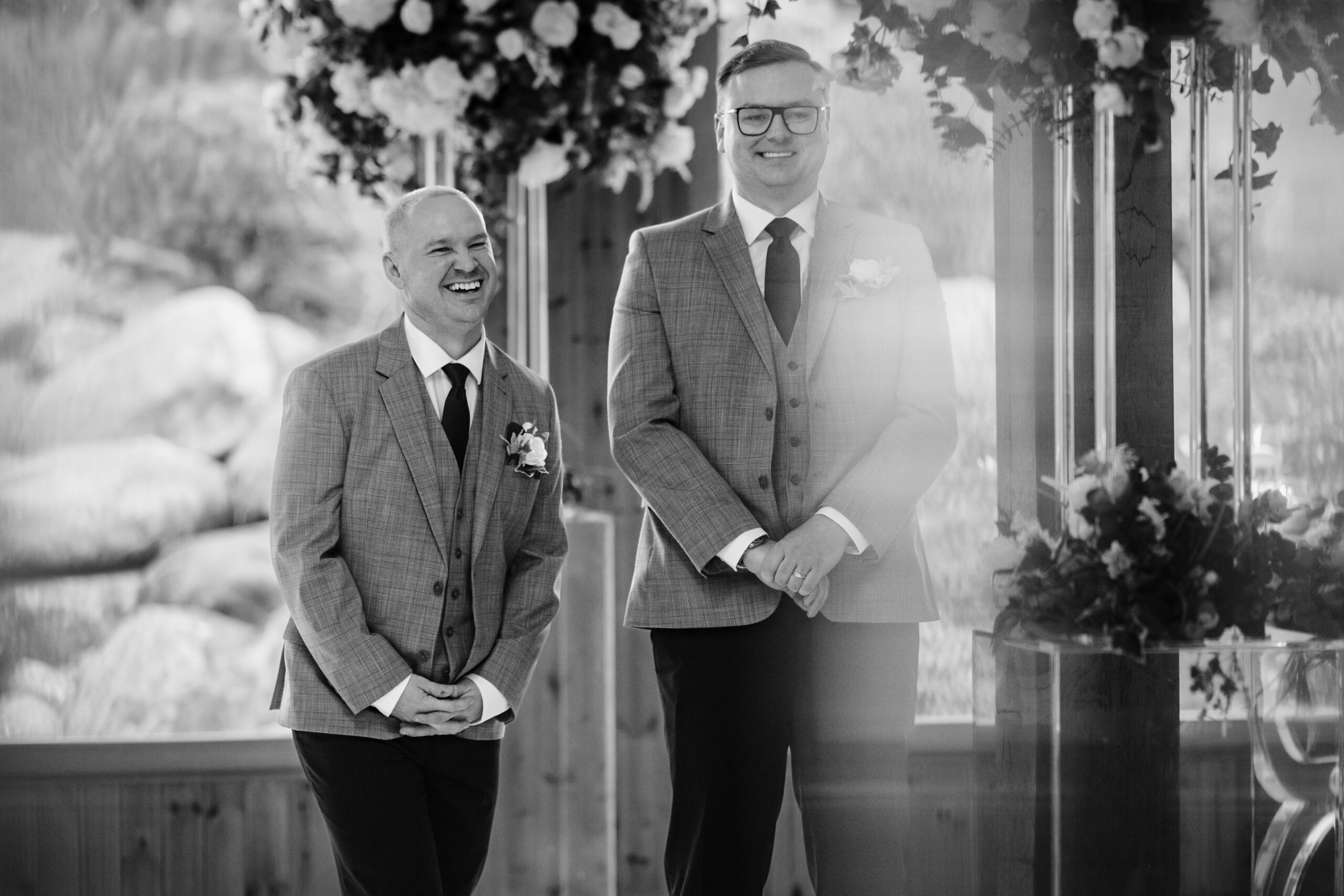 Black and white photo of the groom and his best man waiting at the front of the Ceremony Hall, Colshaw Hall wedding