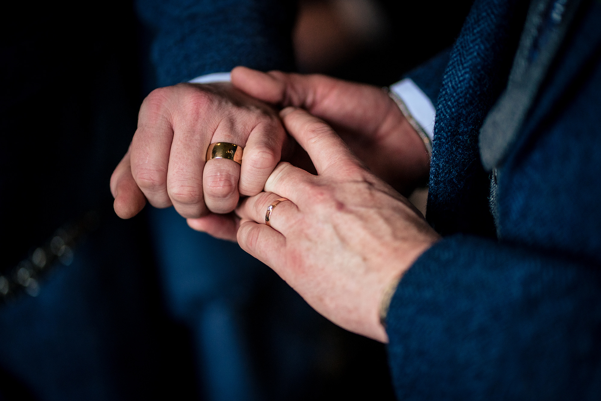 A close up of the ring exchange during the ceremony