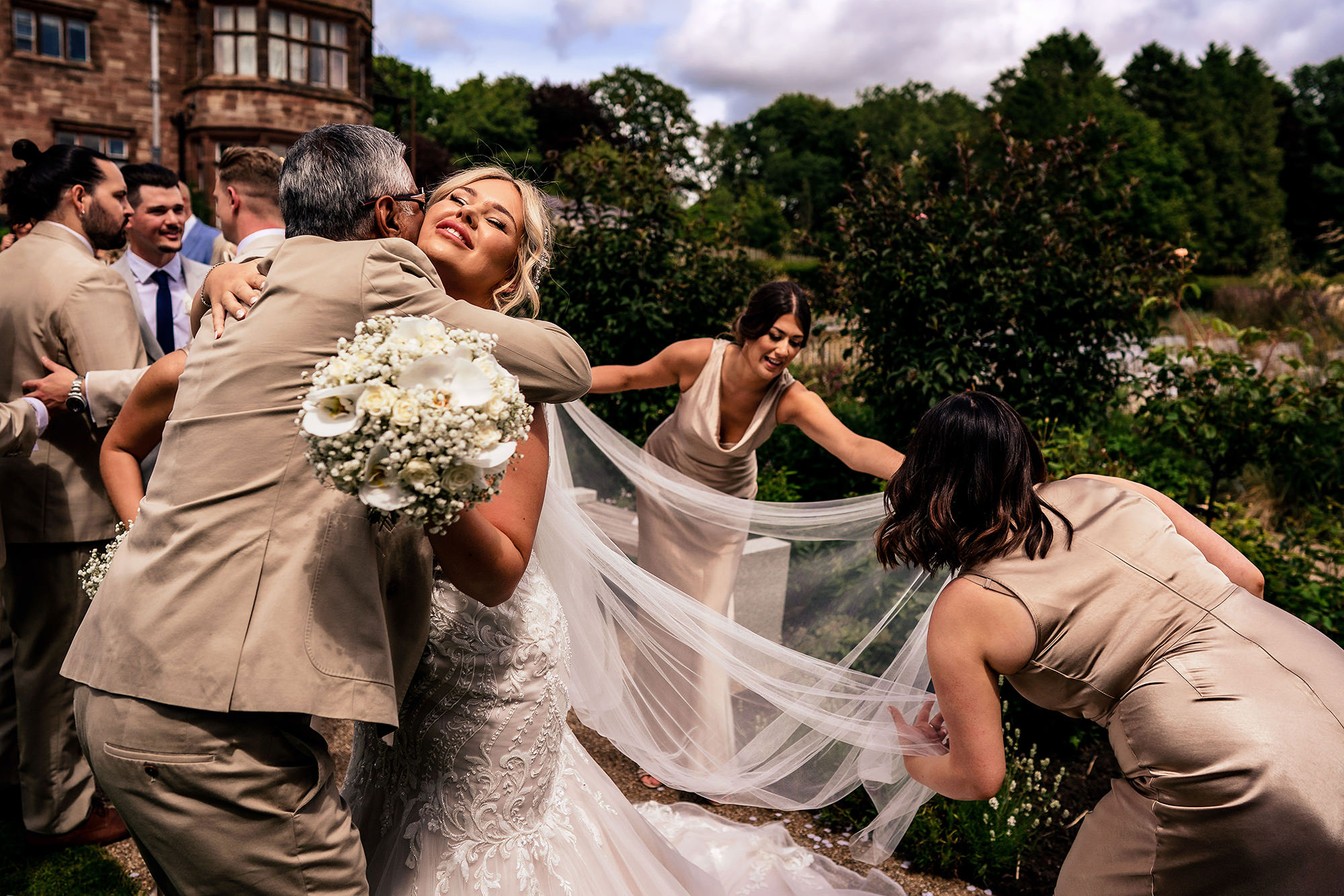 Jess sharing an emotional hug after the ceremony at Salt House, Staffordshire