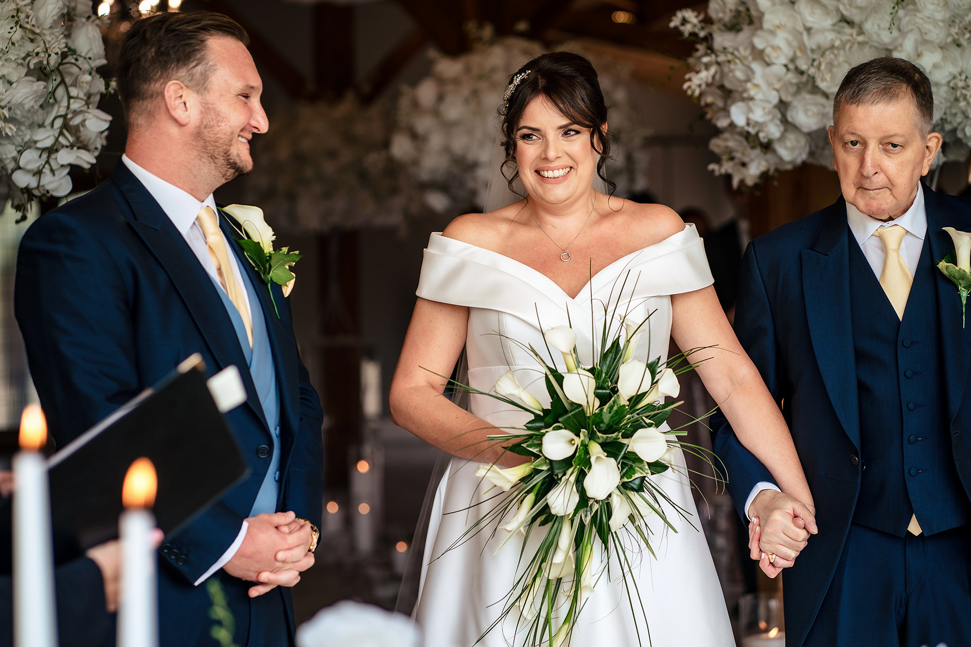 A close moment between Laura and her dad on the way down the aisle, Merrydale Manor wedding photographer
