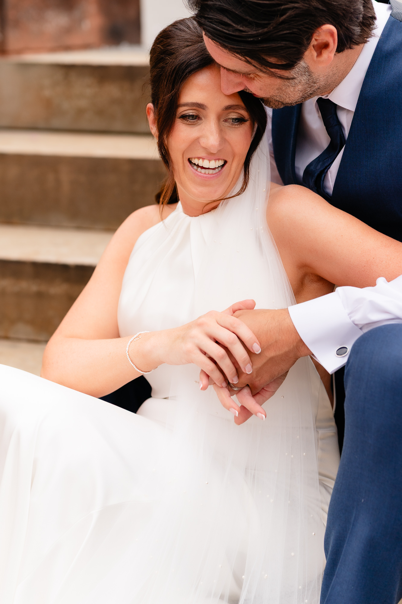 Bride and groom laughing together with foreheads touching, Salt House Staffordshire wedding photographer