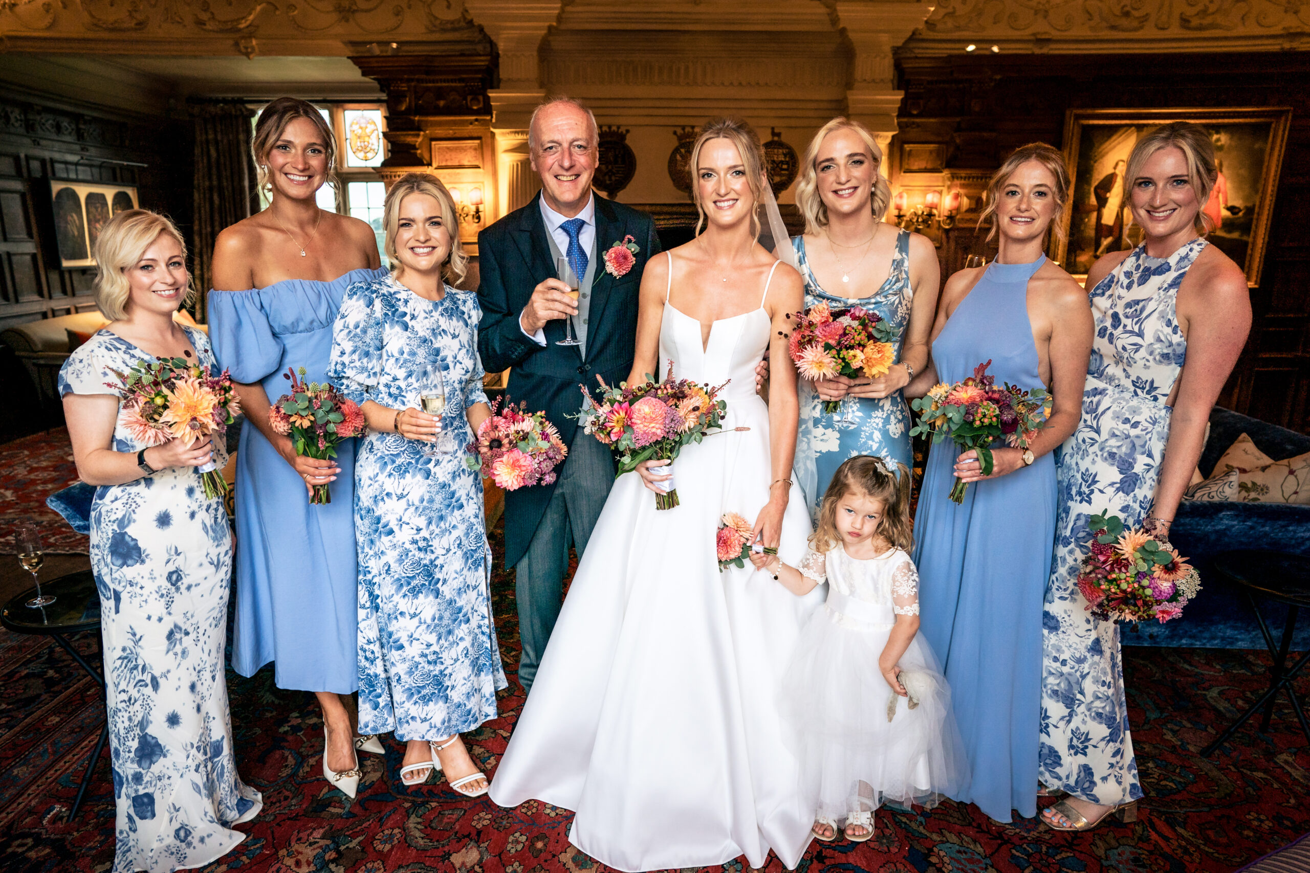 Bride with her bridesmaids and flower girl in the oak panelled room at Dorfold Hall