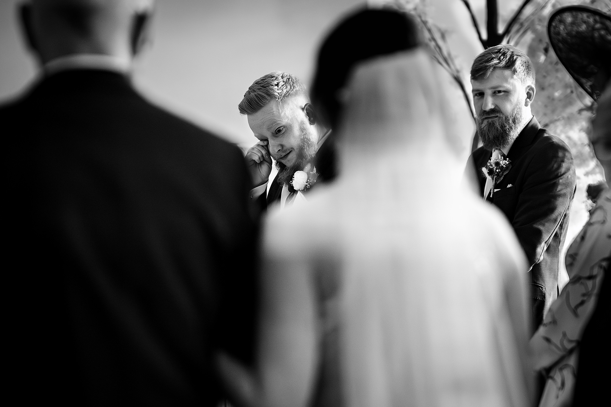 Bride walking into the ceremony room on her dad’s arm, black and white, Salt House wedding photographer