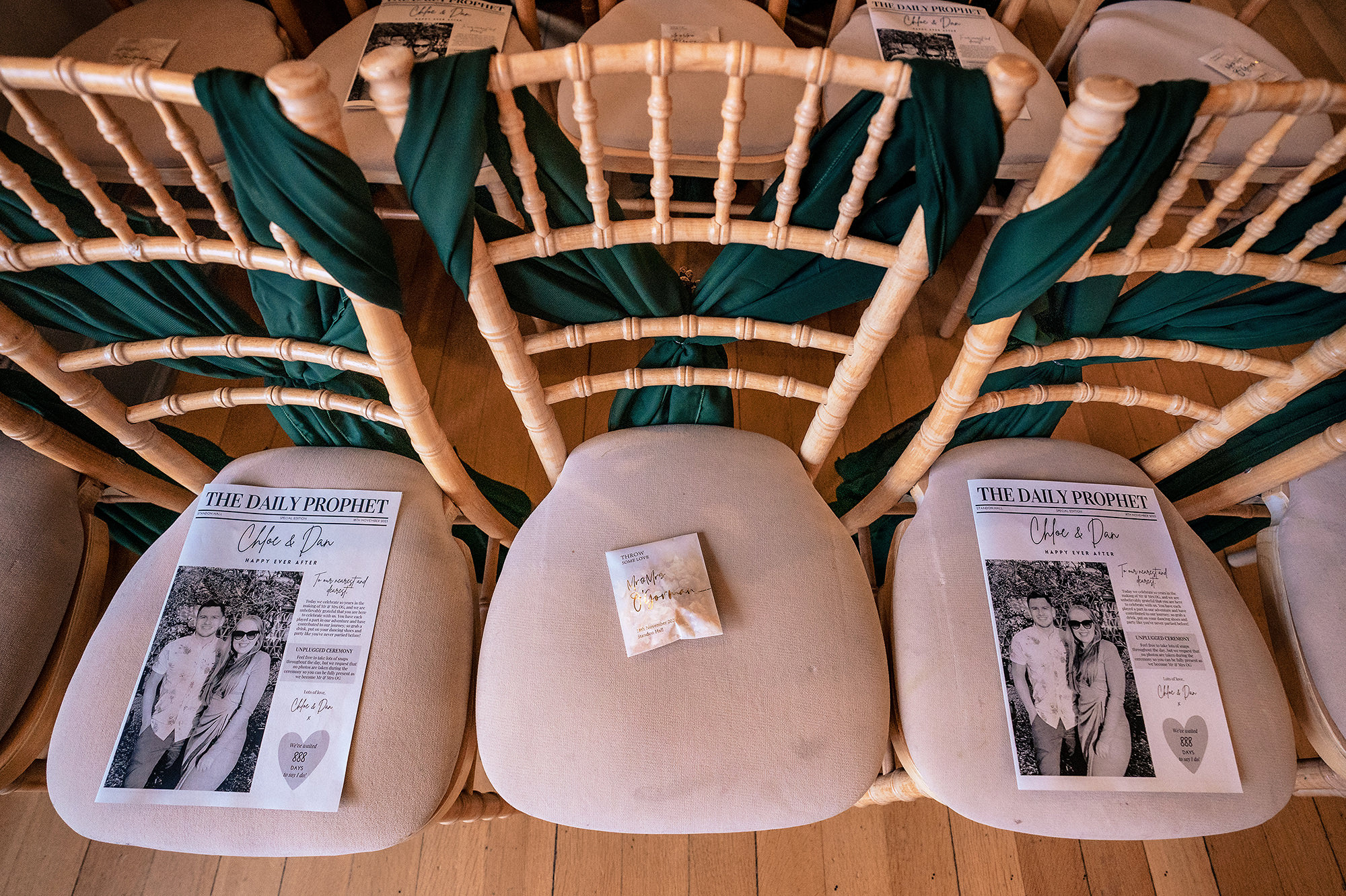 LouPaper order of service scrolls laid out in the Salt House ceremony room