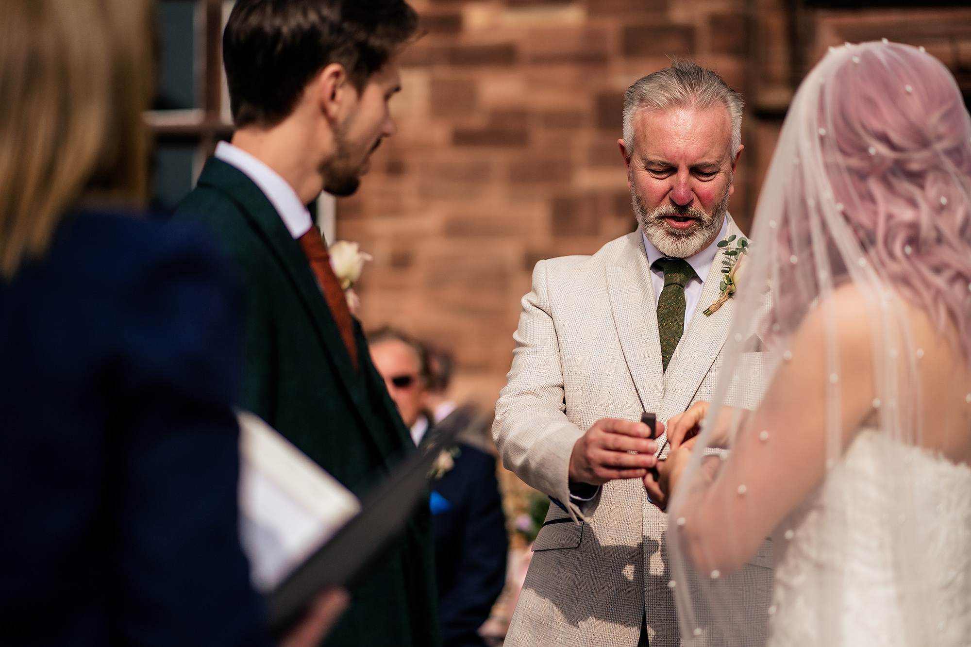 Bride’s dad giving her away to the groom at the altar, Standon Hall wedding photographer
