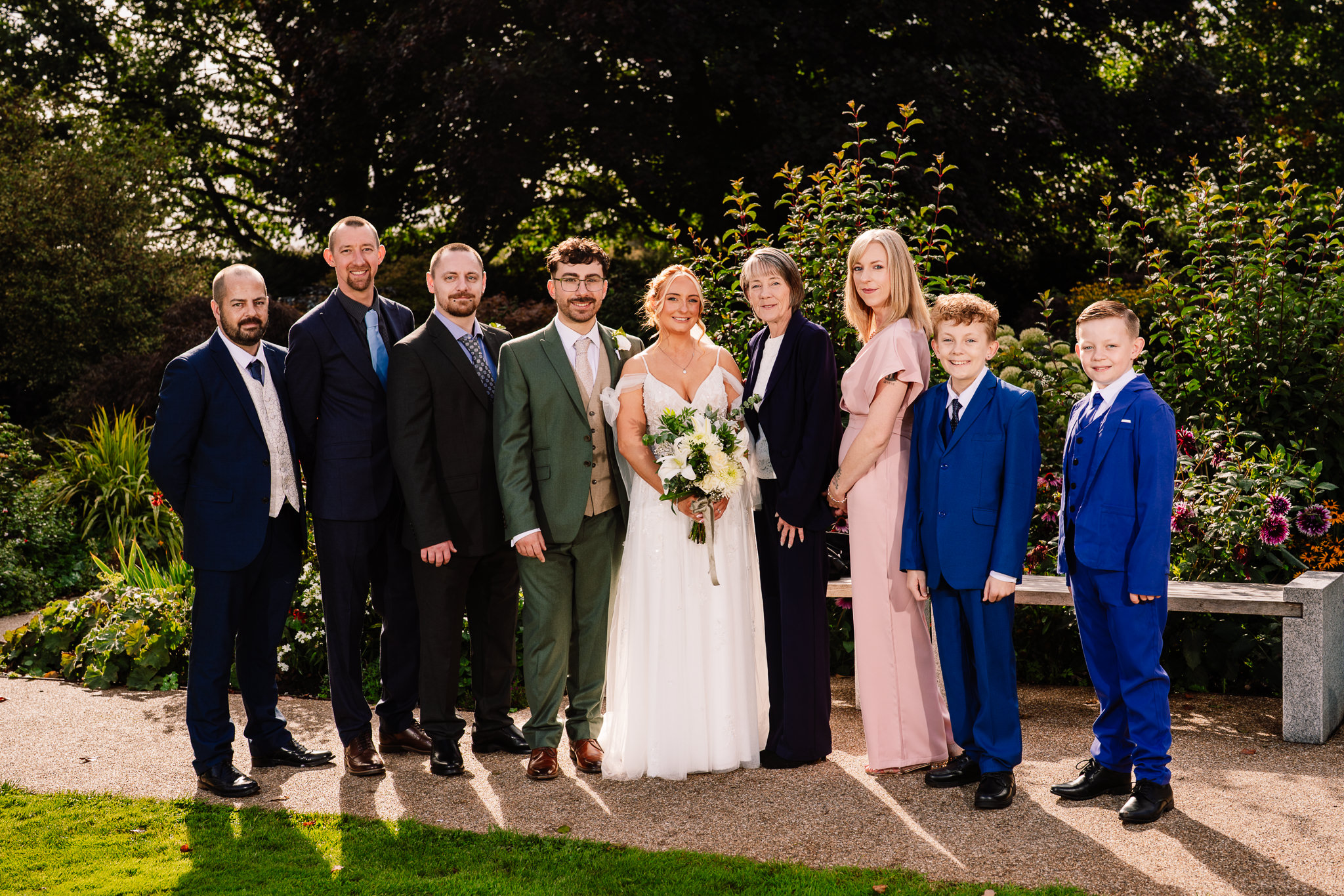 Another family formal group gathered around the bride and groom at Salt House
