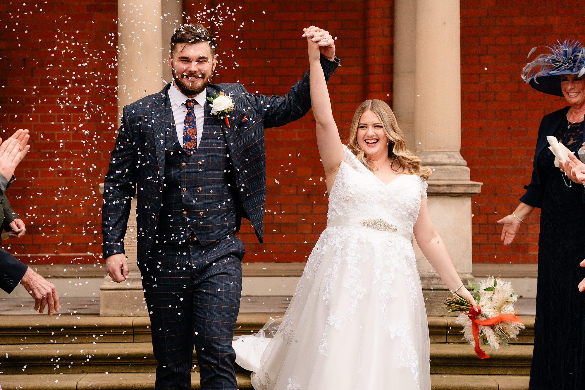 More confetti raining down on the newlyweds outside Crewe Hall, Cheshire wedding photographer