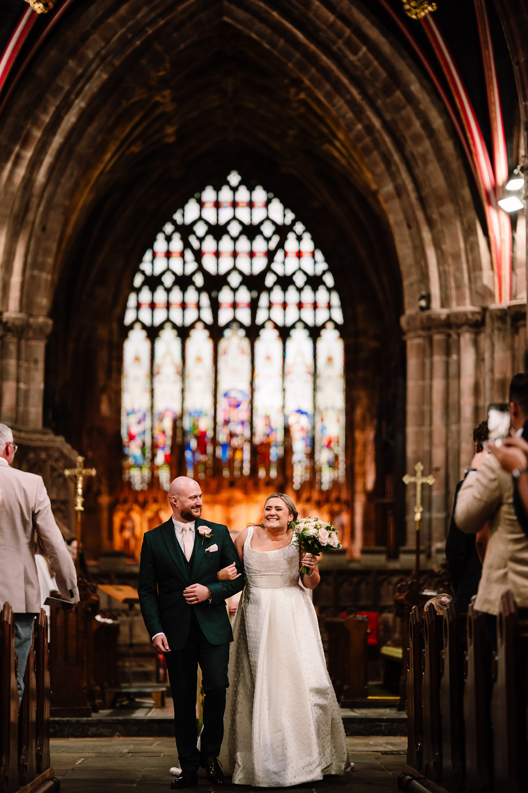 Chloe and Pete beneath the stone arches of St Mary’s Church, Nantwich
