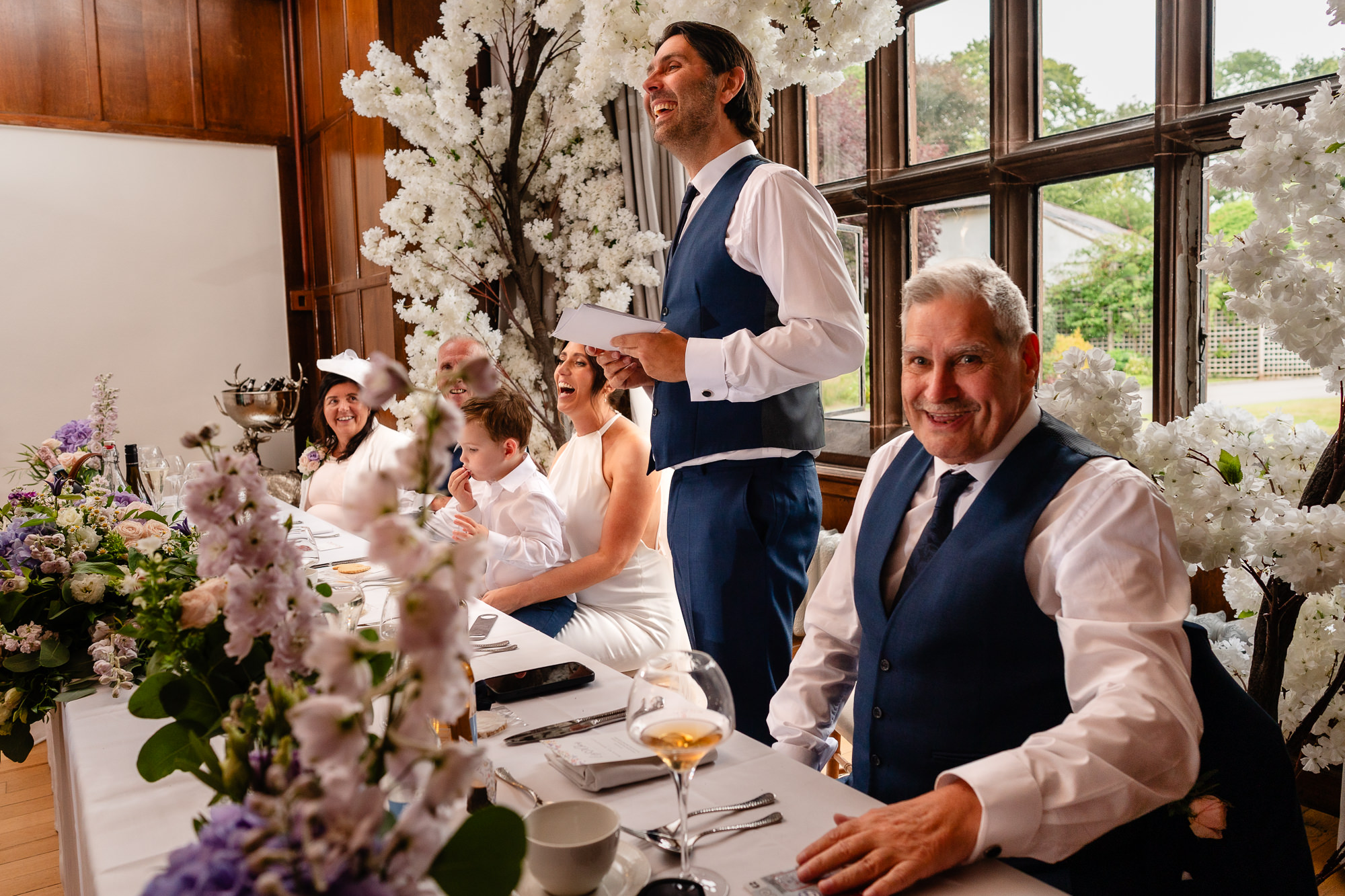Groom laughing while giving his speech at the wedding breakfast, Salt House Staffordshire wedding photographer