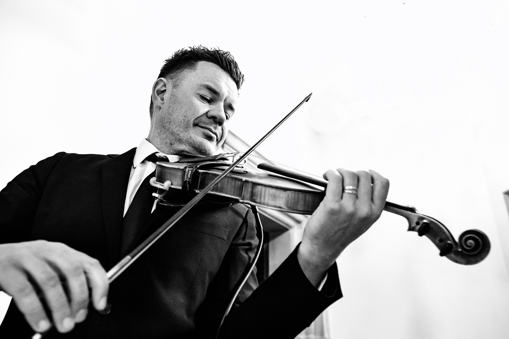 Craig Owen playing the wedding party in on violin at Salt House