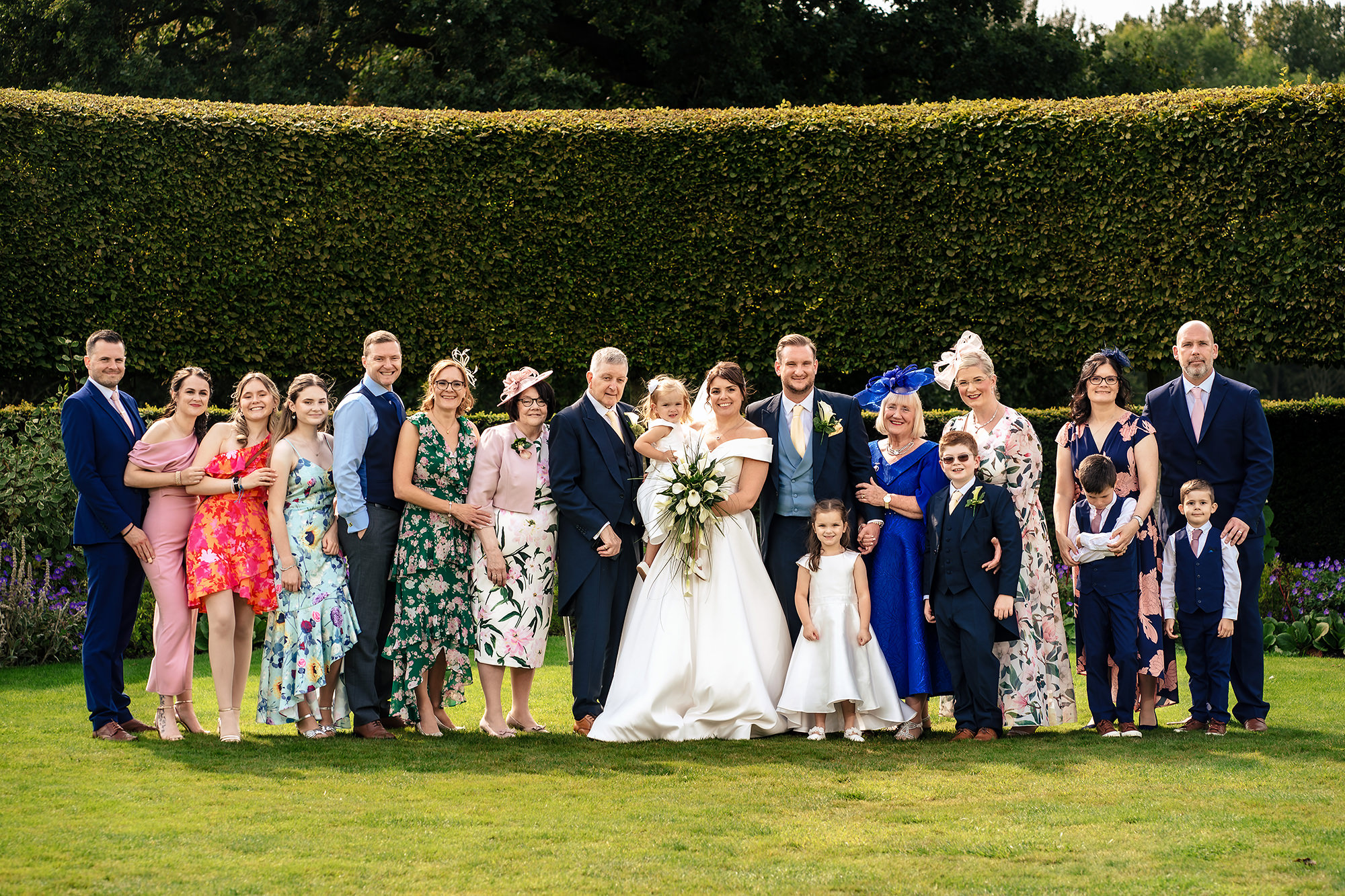 A large family group photo on the lawn, Merrydale Manor wedding photographer