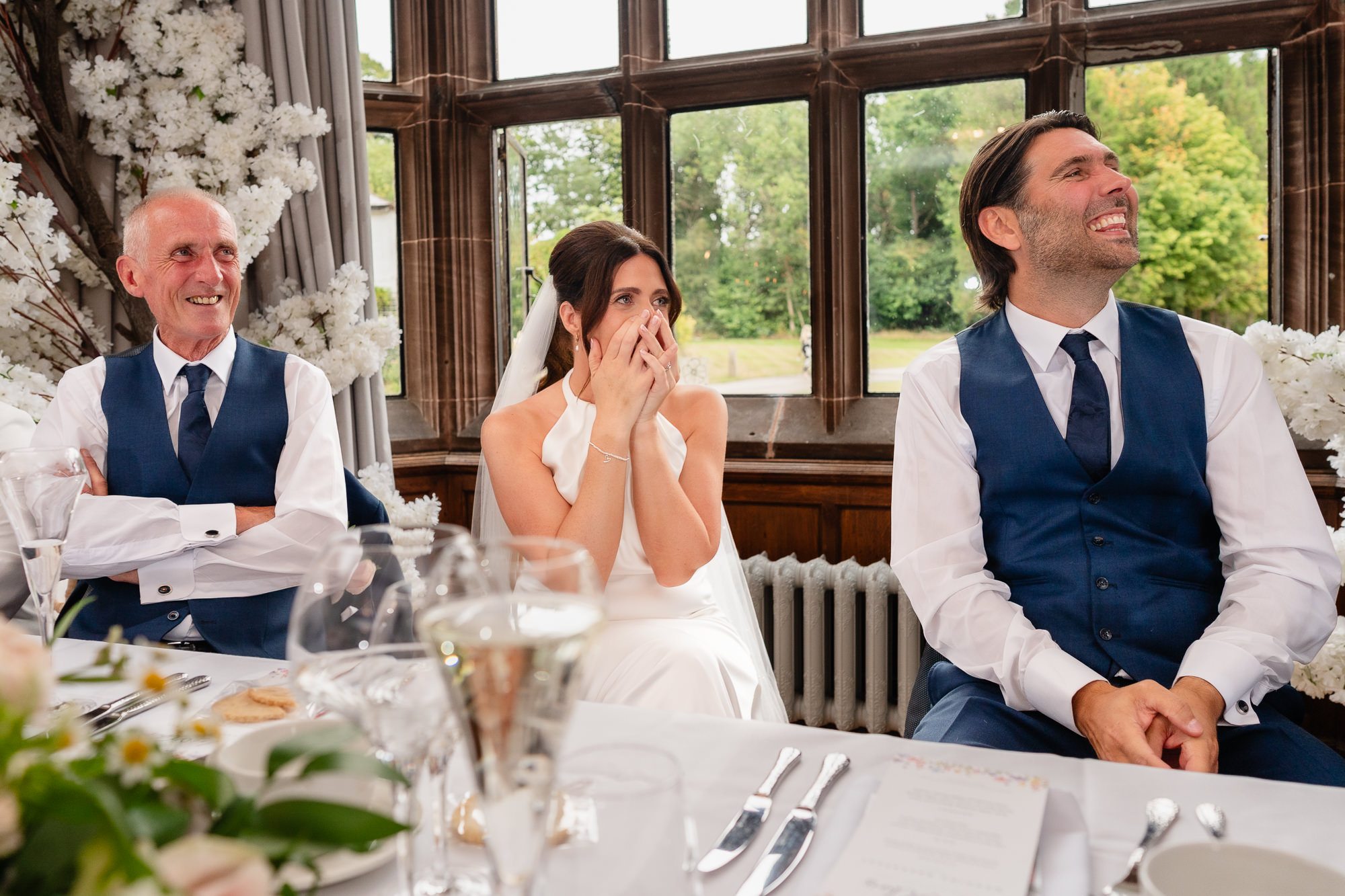 Bride reacting with laughter and emotion during the speeches, Salt House Staffordshire wedding photographer