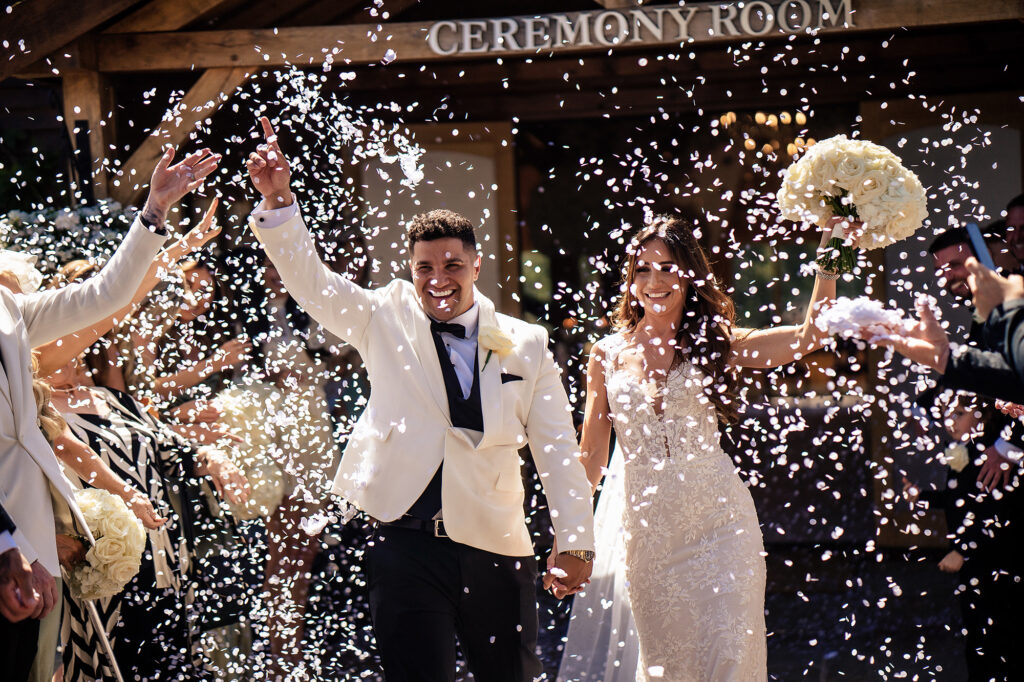 Confetti thrown over Gemma and Tyrone as they leave the Ceremony Room at Merrydale Manor